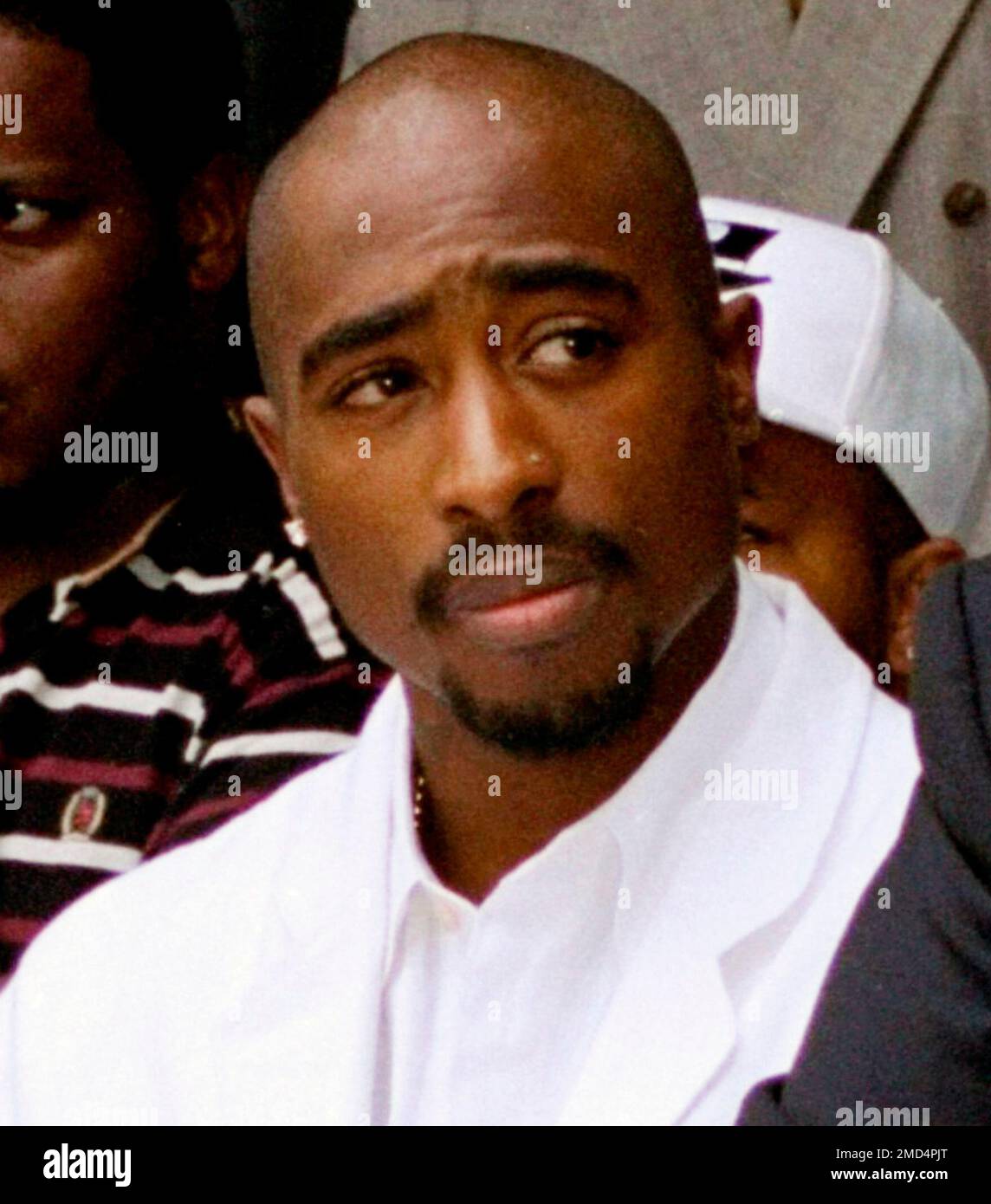FILE - Rapper Tupac Shakur attends a voter registration event in South ...