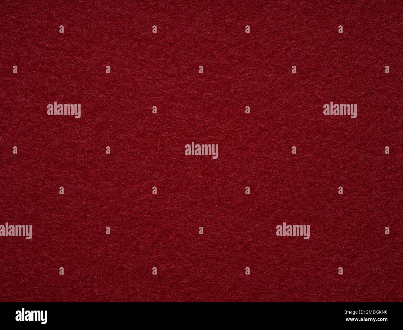 Gros plan sur une texture en feutre blanc rouge foncé. Plein format rétro, motif vintage. Vue de dessus, mise en page, placement pour le texte. Motif en laine texturée pour les magasins de marchandises Banque D'Images