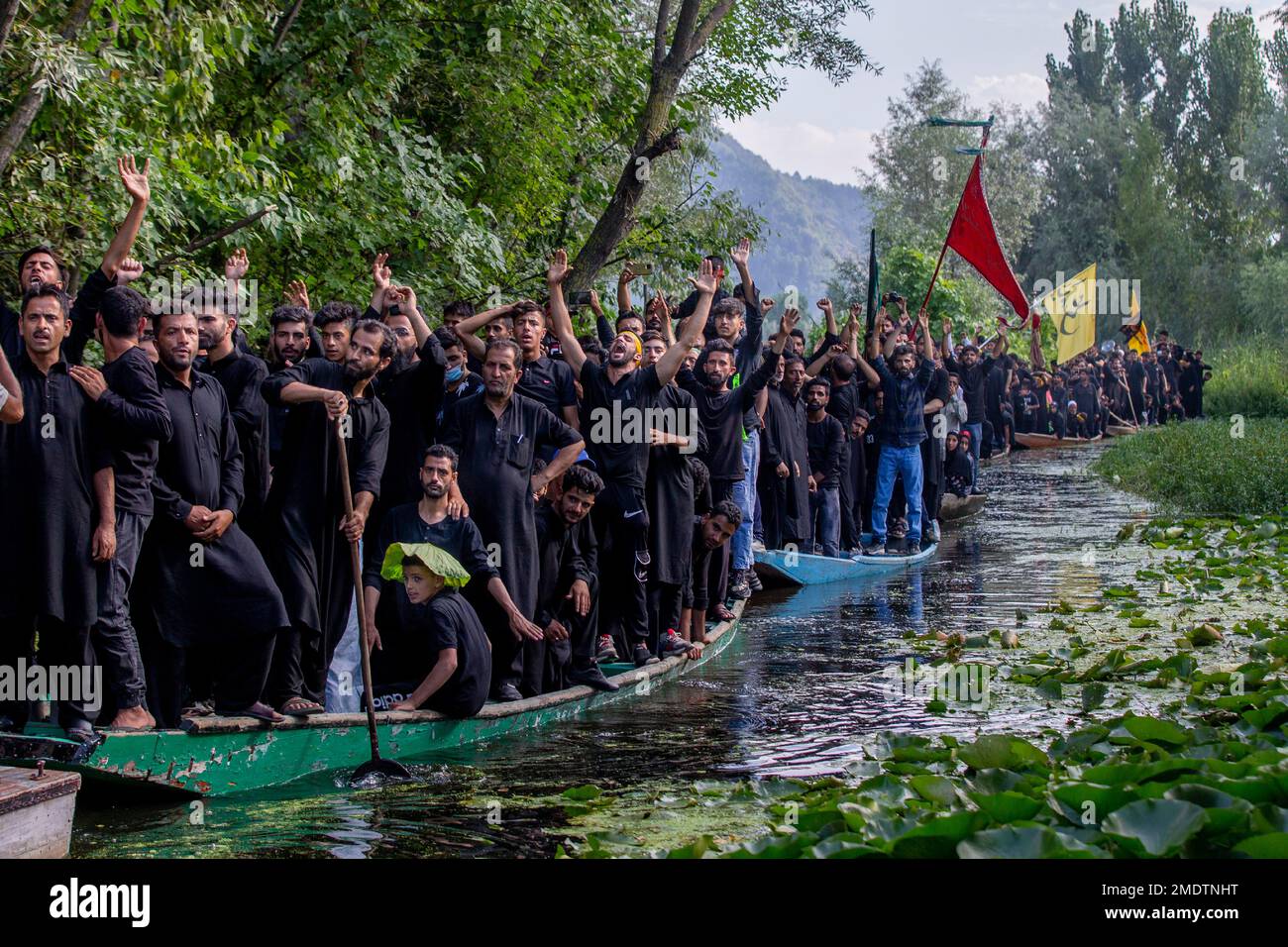 Kashmiri Shiite Muslims shout religious slogans as they participate in ...