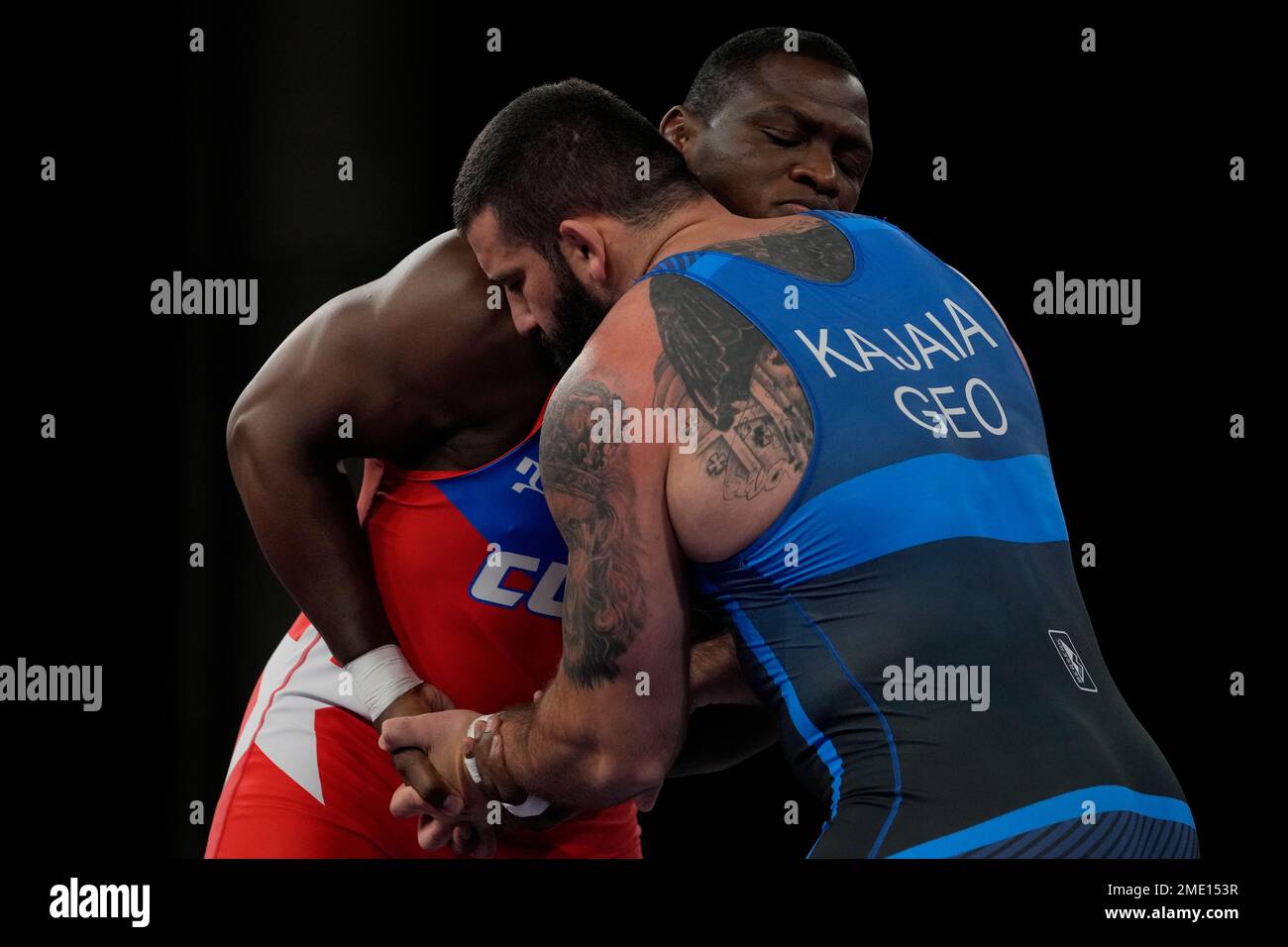 Cuba's Mijain Lopez Nunez, left, and Georgia's Lakobi Kajaia compete during the men's 130kg Greco-Roman wrestling final match at the 2020 Summer Olympics, Monday, Aug. 2, 2021, in Chiba, Japan. (AP Photo/Aaron Favila) Banque D'Images