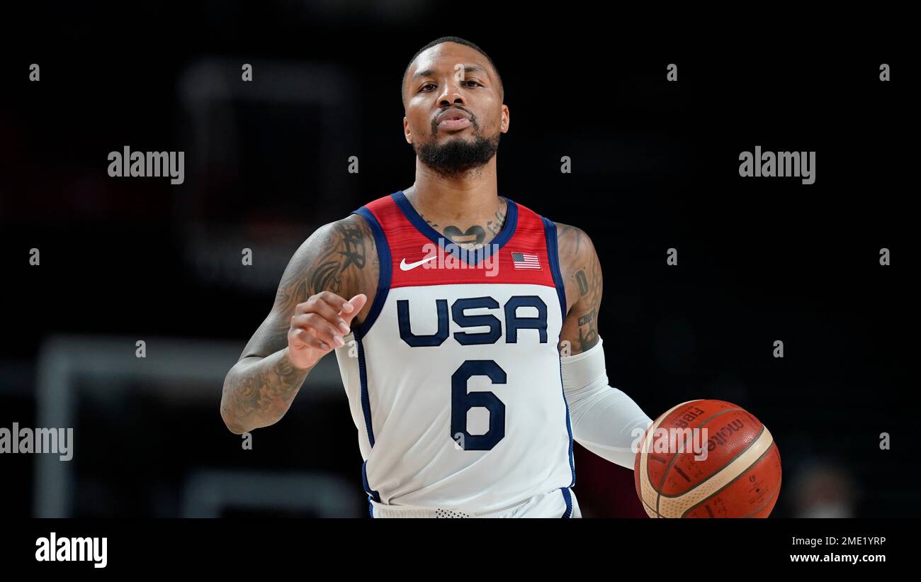 United States's Damian Lillard (6) drives up court during a men's basketball preliminary round game against the Czech Republic at the 2020 Summer Olympics, Saturday, July 31, 2021, in Saitama, Japan. (AP Photo/Charlie Neibergall) Banque D'Images