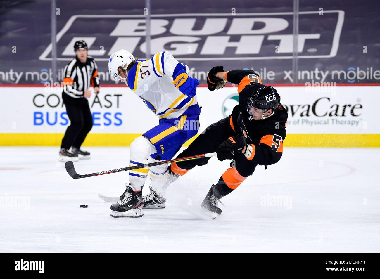Buffalo Sabres' Casey Mittelstadt, left, skates the puck past Philadelphia Flyers' Philippe Myers, right, during the second period of an NHL hockey game, Sunday, April 11, 2021, in Philadelphia. (AP Photo/Derik Hamilton) Banque D'Images