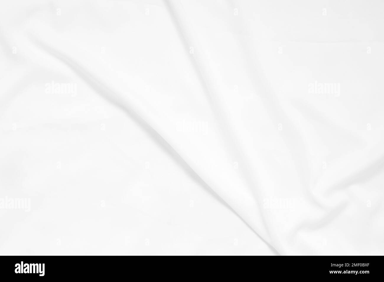 Vague abstraite et douce de mise au point de fond en tissu blanc, texture et détails blancs Banque D'Images