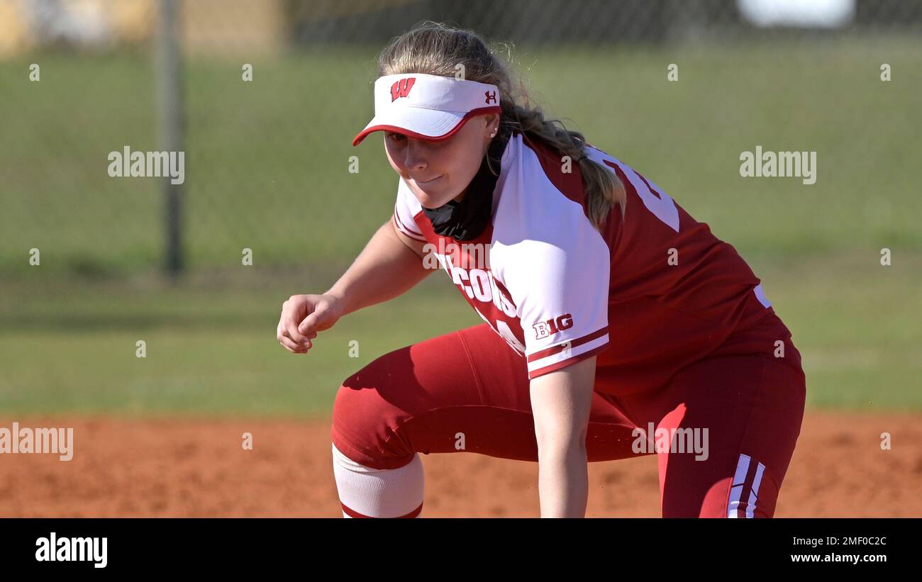 Wisconsin infielder Lauren Foster (24) has a throw get past her during an NCAA college softball game against Michigan on Sunday, March 14, 2021, in Leesburg, Fla. (AP Photo/Phelan M. Ebenhack) Banque D'Images