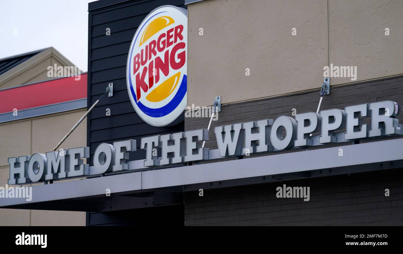A "Home of the Whopper" sign welcomes customers outside the Burger King fast food restaurant, Monday, Feb. 1, 2021, in Epping, N.H. (AP Photo/Charles Krupa) Banque D'Images