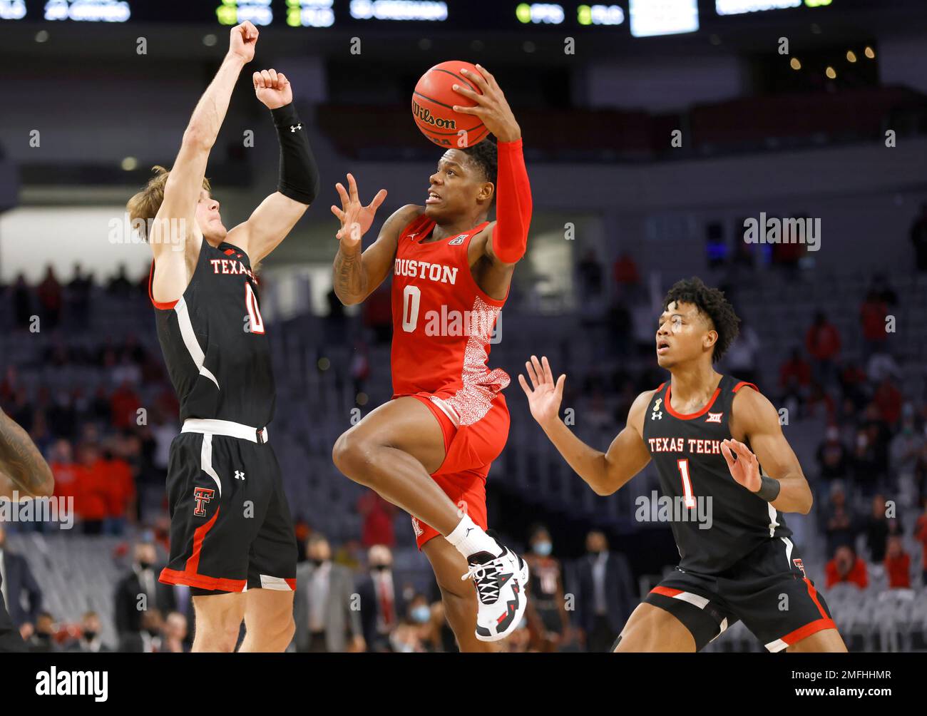 Houston guard Marcus Sasser (0) goes up to shoot over Texas Tech guard