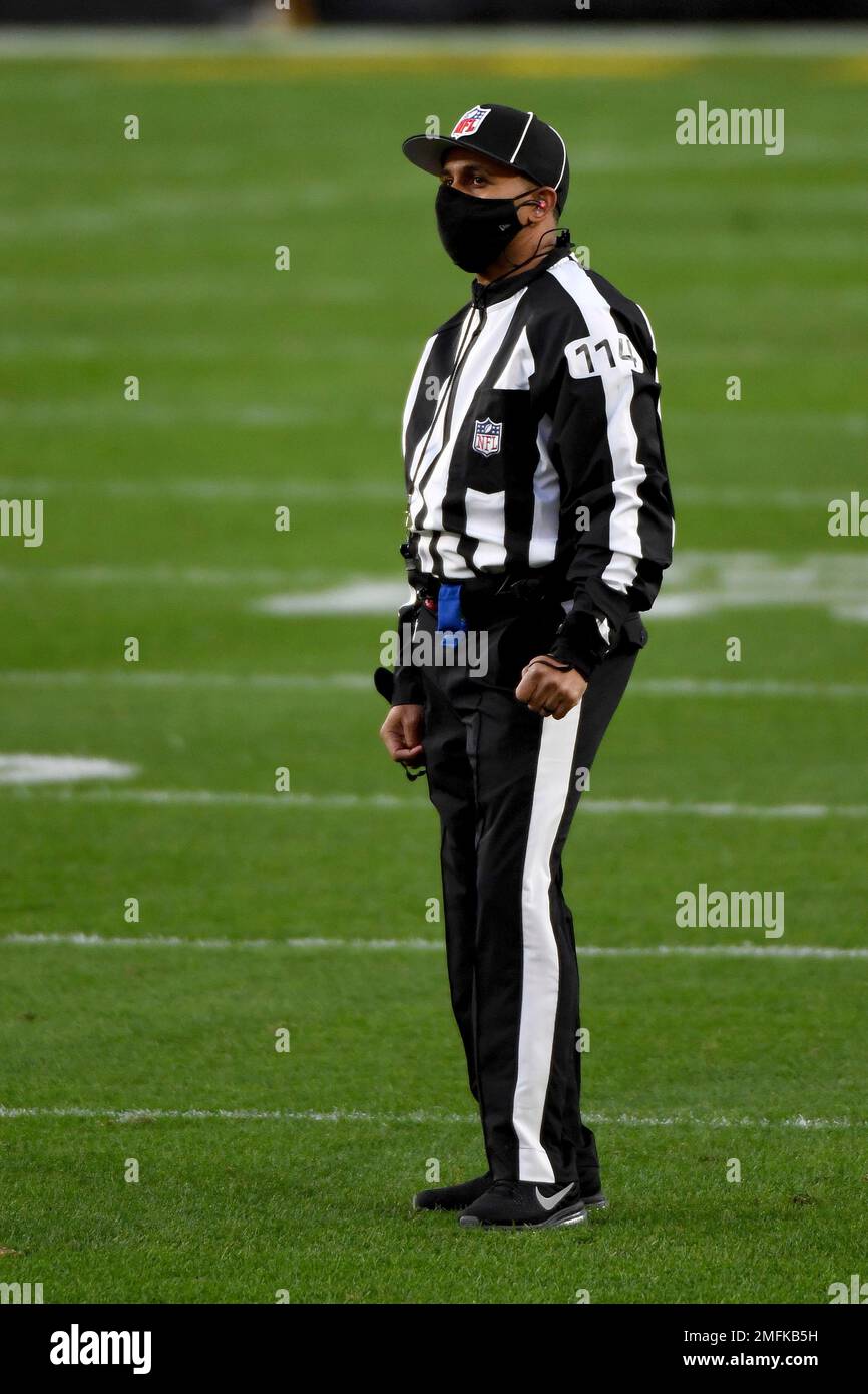NFL side judge Dominique Pender (114) looks on during an NFL football