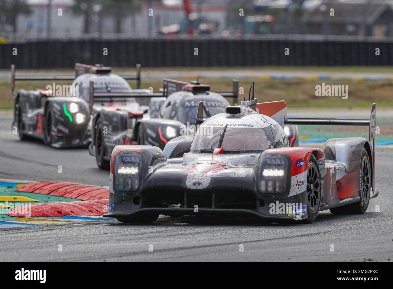 The Toyota TS050 Hybrid No7 of the Toyota Gazoo Racing Team driven by Mike Conway of Britain, Kamui Kobayashi of Japan and Jose Maria Lopez of Argentina is seen in action ahead of the The Rebellion R13 No3 and the The Rebellion R13 No1 during the 88th 24-hour Le Mans endurance race, in Le Mans, western France, Sunday, Sept. 20, 2020. Due to coronavirus crisis, the race takes place without spectators. (AP Photo/David Vincent) Banque D'Images