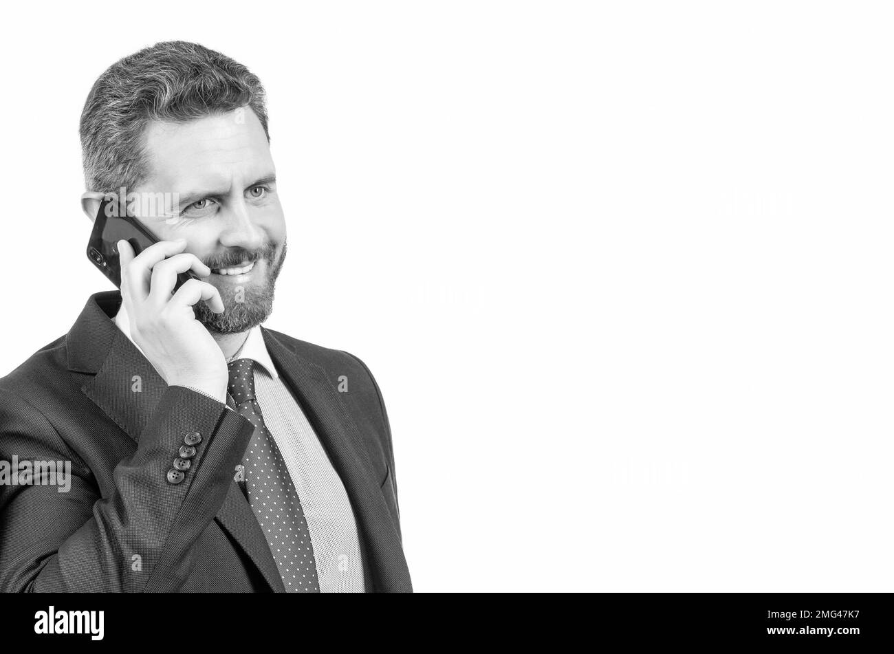 Communication mobile. Un homme heureux parle sur un téléphone portable. Les hommes d'affaires utilisent le téléphone portable dans leurs affaires Banque D'Images