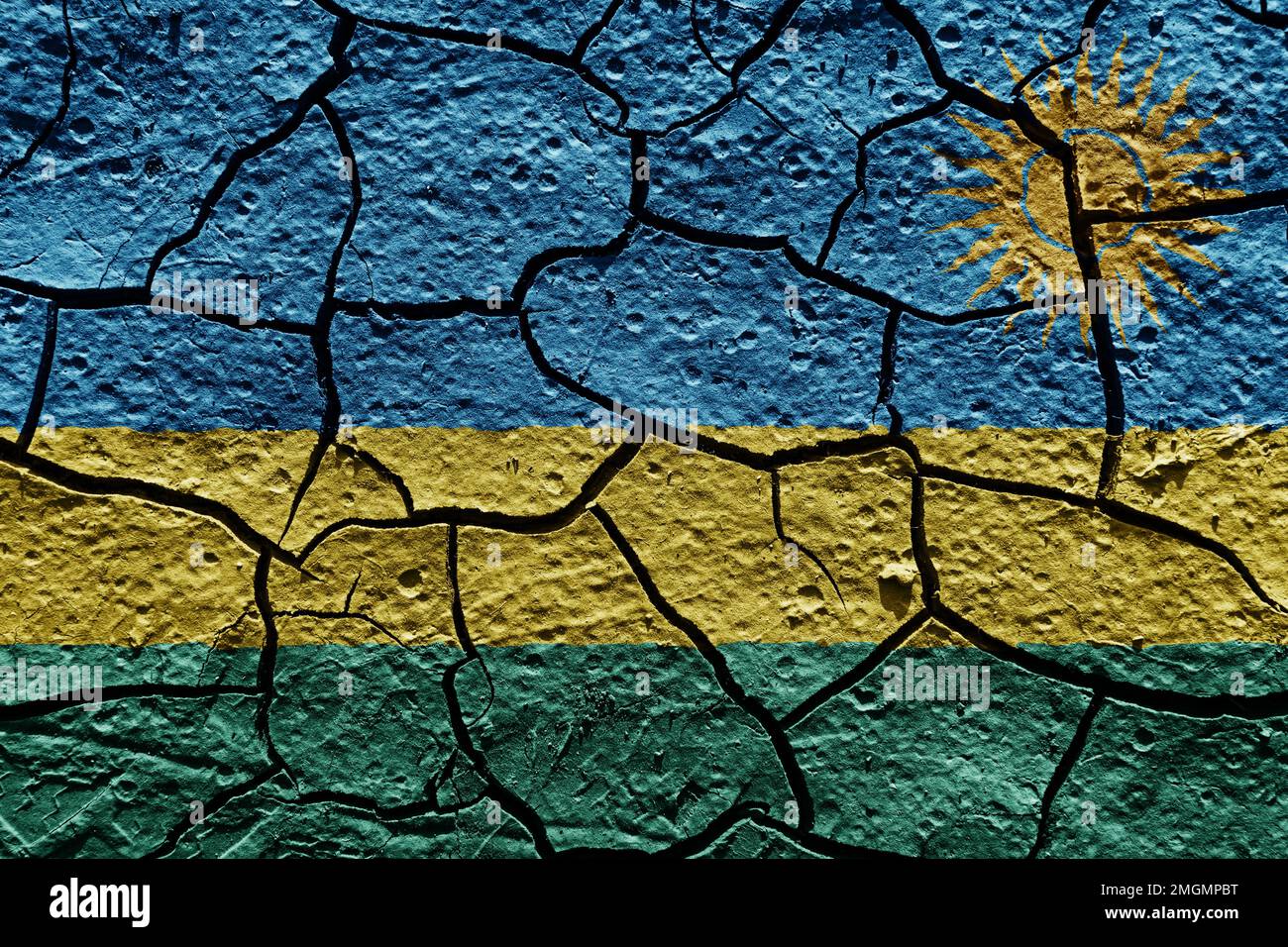 Drapeau du Rwanda sur une texture de boue de crack sec sur le sol Banque D'Images