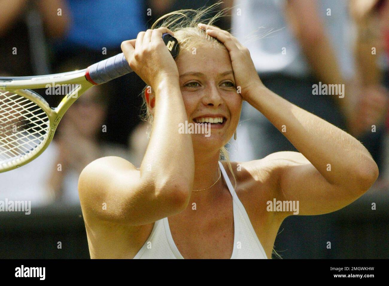 FILE - In this July 1, 2004, file photo, Russia's Maria Sharapova reacts  after defeating Lindsay Davenport in their Women's Singles semi-final match  on the Centre Court at Wimbledon. Sharapova is retiring