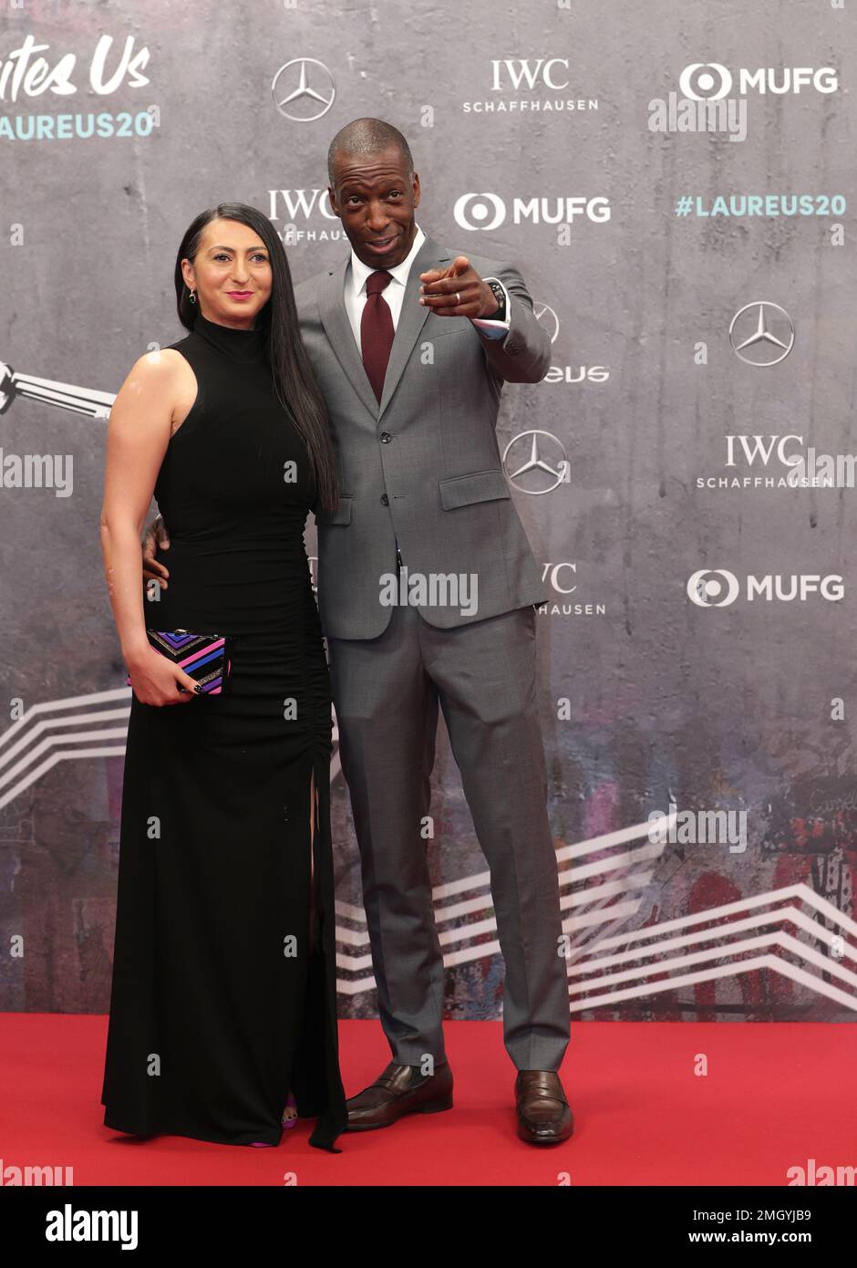 Former track star Michael Johnson and his wife Kerry Doyen arrive for ...