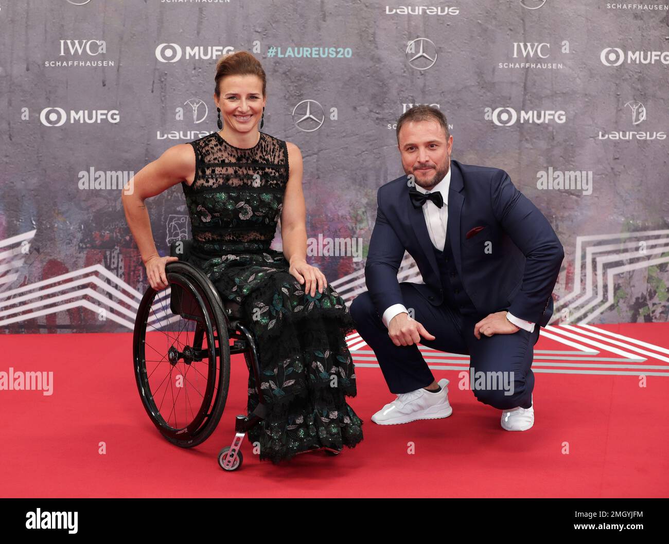 Swiss wheelchair athlete Manuela Schar and unidentified partner arrive for the 2020 Laureus World Sports Awards in Berlin, Germany, Monday, Feb. 17, 2020. (AP Photo/Michael Sohn) Banque D'Images