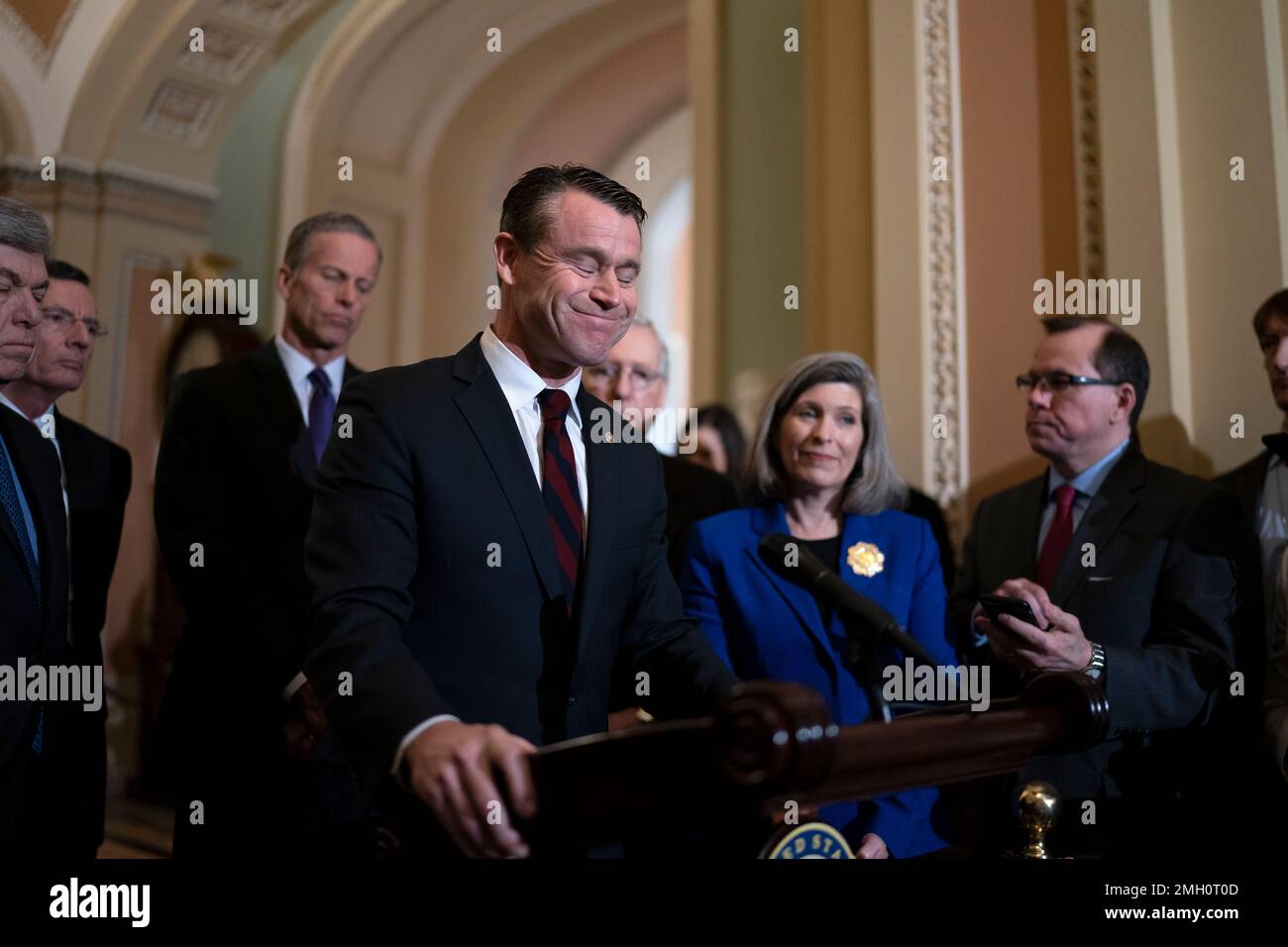 Sen. Todd Young, R-Ind., pauses as he speaks to media with Senate Majority Leader Mitch McConnell, R-Ky., and GOP leaders at the Capitol in Washington, Tuesday, Feb. 11, 2020. Standing with Young are left, Sen. Roy Blunt, R-Mo., Sen. John Barrasso, R-Wyo., Majority Whip John Thune, R-S.D., McConnelln, Sen. Joni Ernst, R-Iowa(AP Photo/J. Scott Applewhite) Banque D'Images