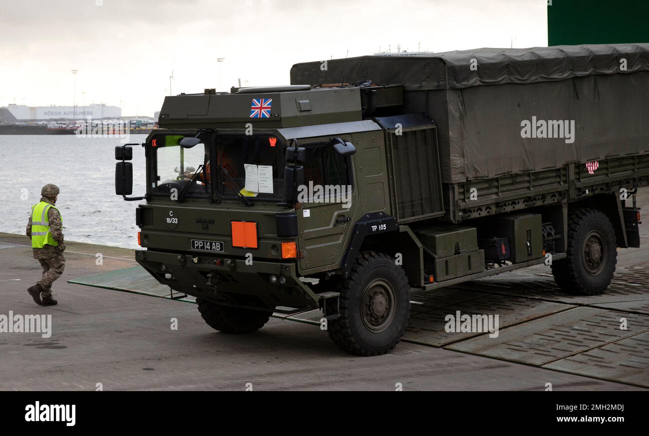 Heavy equipment and vehicles arrive from a British naval vessel, taking part in U.S.-led war games, as they are unloaded at the Port of Antwerp in Antwerp, Belgium, Monday Feb. 3, 2020. The Defender-Europe 2020 exercises will involve approximately 20,000 American troops; the biggest deployment of U.S.-based soldiers to Europe in 25 years. (AP Photo/Virginia Mayo) Banque D'Images