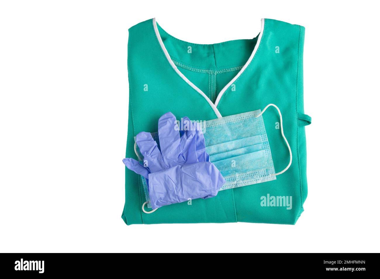 ensemble d'uniformes médicaux plié sur l'infirmière de fond isolée Banque D'Images