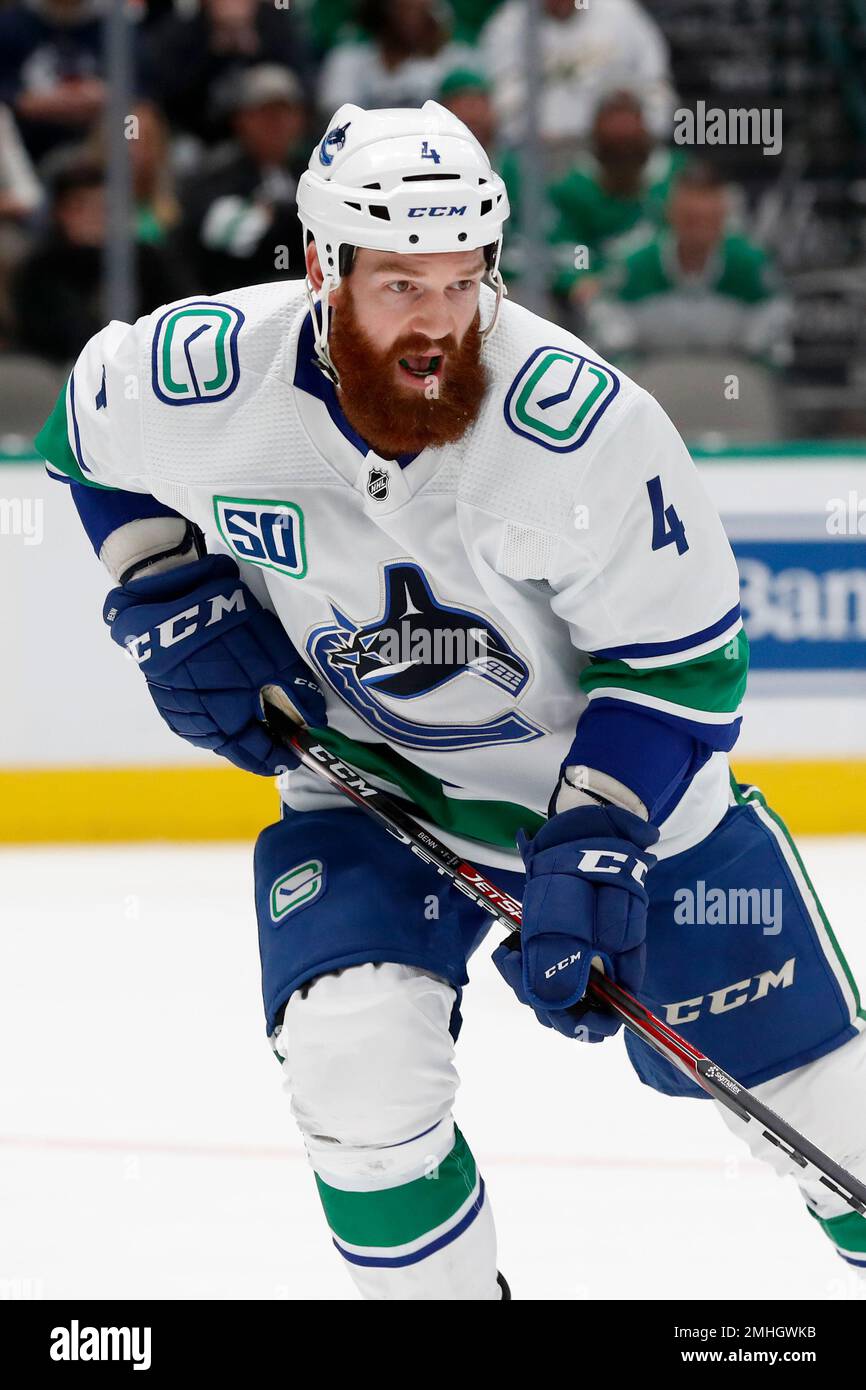 Vancouver Canucks defenseman Jordie Benn (4) follows play during an NHL hockey game against the Dallas Stars in Dallas, Tuesday, Nov. 19, 2019. (AP Photo/Tony Gutierrez) Banque D'Images