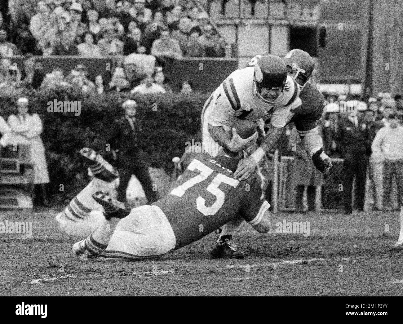 FILE - In this Jan. 11, 1970, file photo, Minnesota Viking quarterback Joe  Kapp is hauled down by Kansas City Chiefs' Jerry Mays (75) as another  Chiefs player moves in from the