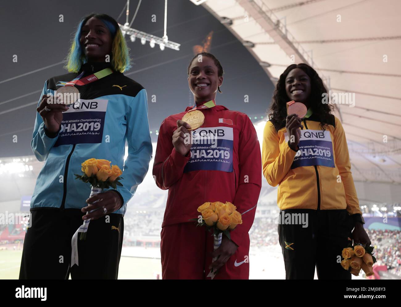 Salwa Eid Naser of Bahrain, center, Shaunae MillerUibo of Bahamas
