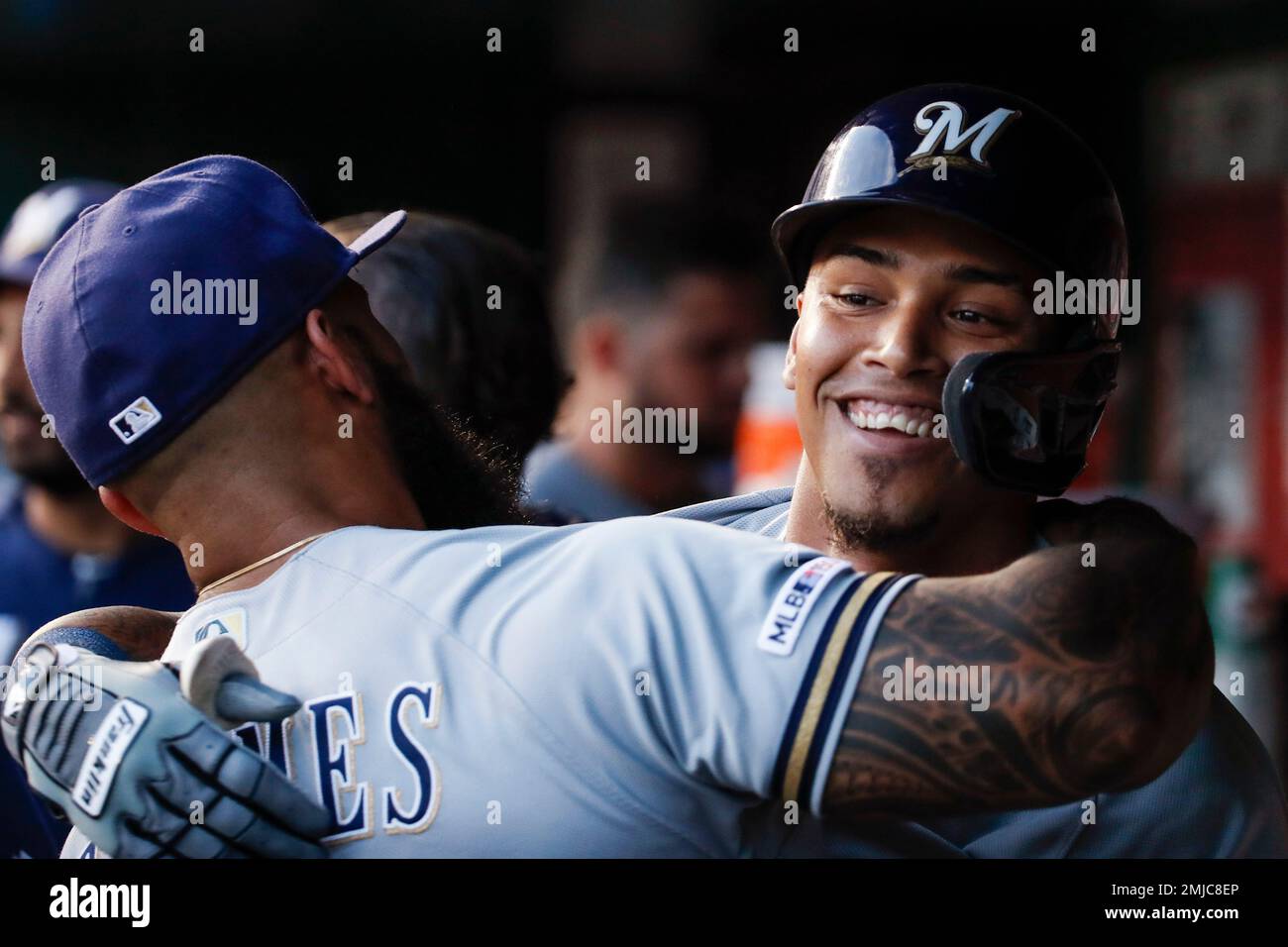 Milwaukee Brewers' Orlando Arcia, right, celebrates with Eric Thames after Arcia's solo home run during the third inning of the team's baseball game against the Washington Nationals at Nationals Park, Friday, Aug. 16, 2019, in Washington. (AP Photo/Alex Brandon) Banque D'Images