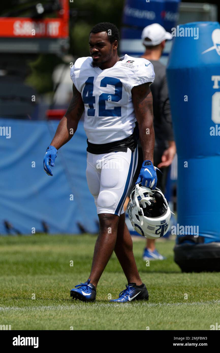 Indianapolis Colts defensive back Rolan Milligan (42) walks to the field for practice at the NFL team's football training camp in Westfield, Ind., Sunday, July 28, 2019. (AP Photo/Michael Conroy) Banque D'Images