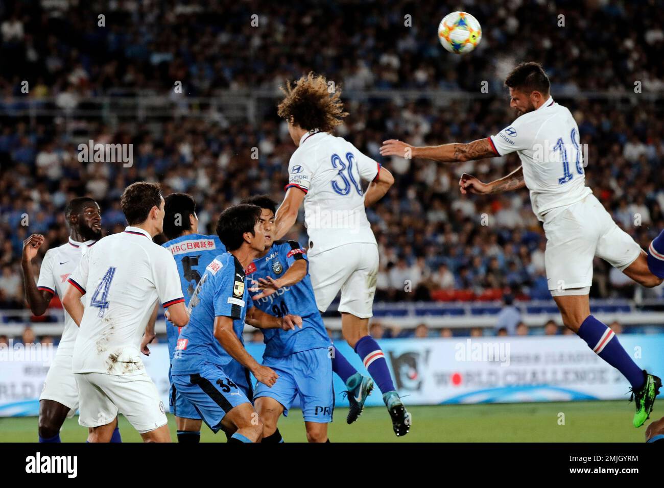 Chelsea's Olivier Giroud, right, heads the ball during a soccer match between Chelsea FC and Kawasaki Frontale in Yokohama, Japan, Friday, July 19, 2019. (AP Photo/Eugene Hoshiko) Banque D'Images