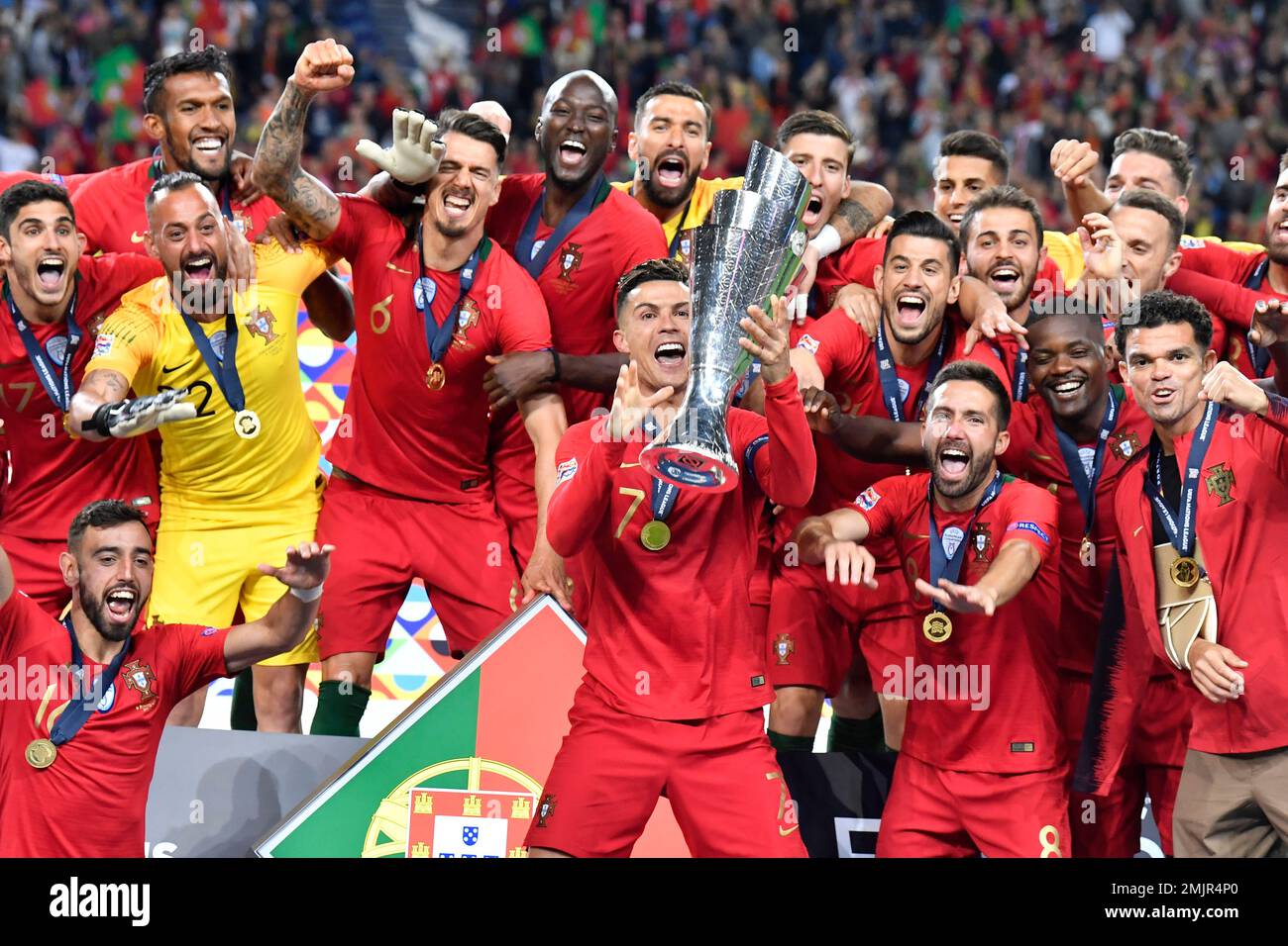 Portugal's Cristiano Ronaldo lifts up the trophy as he celebrates with players after winning the UEFA Nations League final soccer match between Portugal and Netherlands at the Dragao stadium in Porto, Portugal, Sunday, June 9, 2019. Portugal won 1-0. (AP Photo/Martin Meissner) Banque D'Images