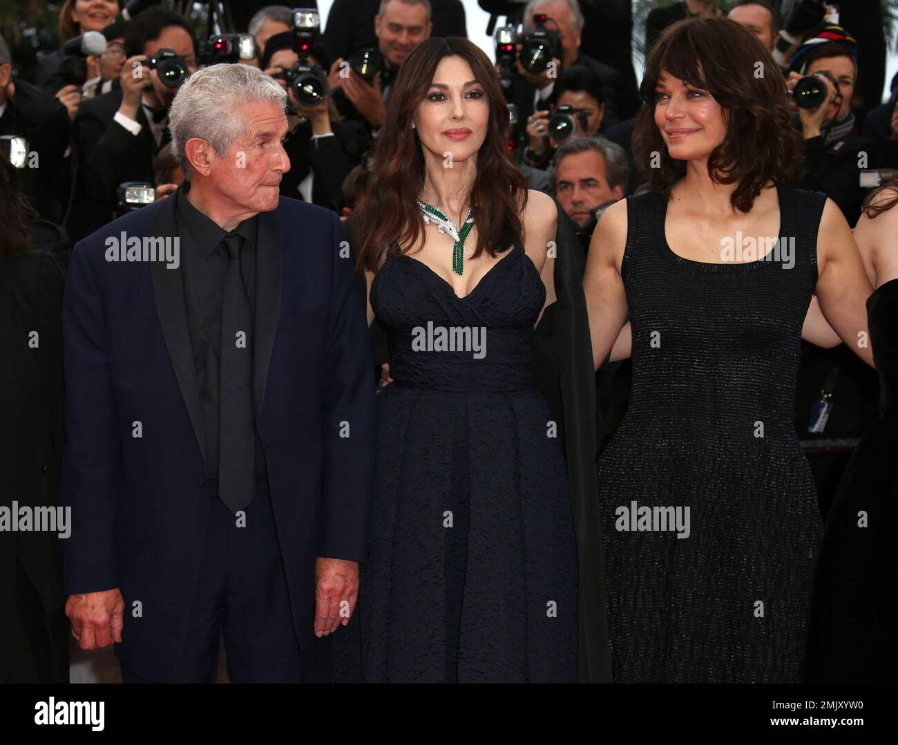 Actresses Marianne Denicourt, from right, Monica Bellucci and director Claude Lelouch pose for photographers upon arrival at the premiere of the film 'The Best Years of a Life' at the 72nd international film festival, Cannes, southern France, Saturday, May 18, 2019. (Photo by Arthur Mola/Invision/AP) Banque D'Images
