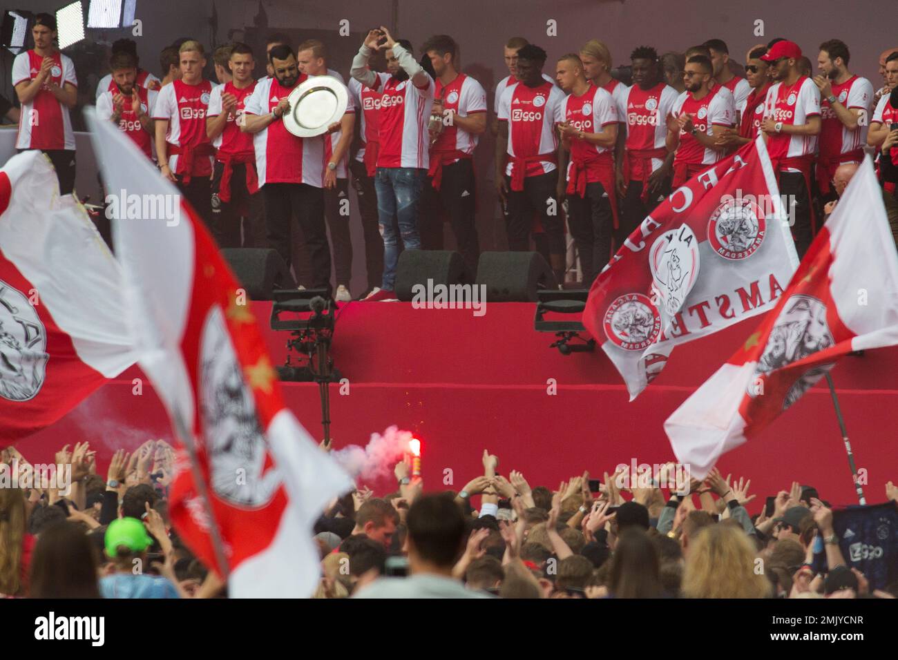 The father of former Ajax soccer player Abdelhak Nouri holds the trophy