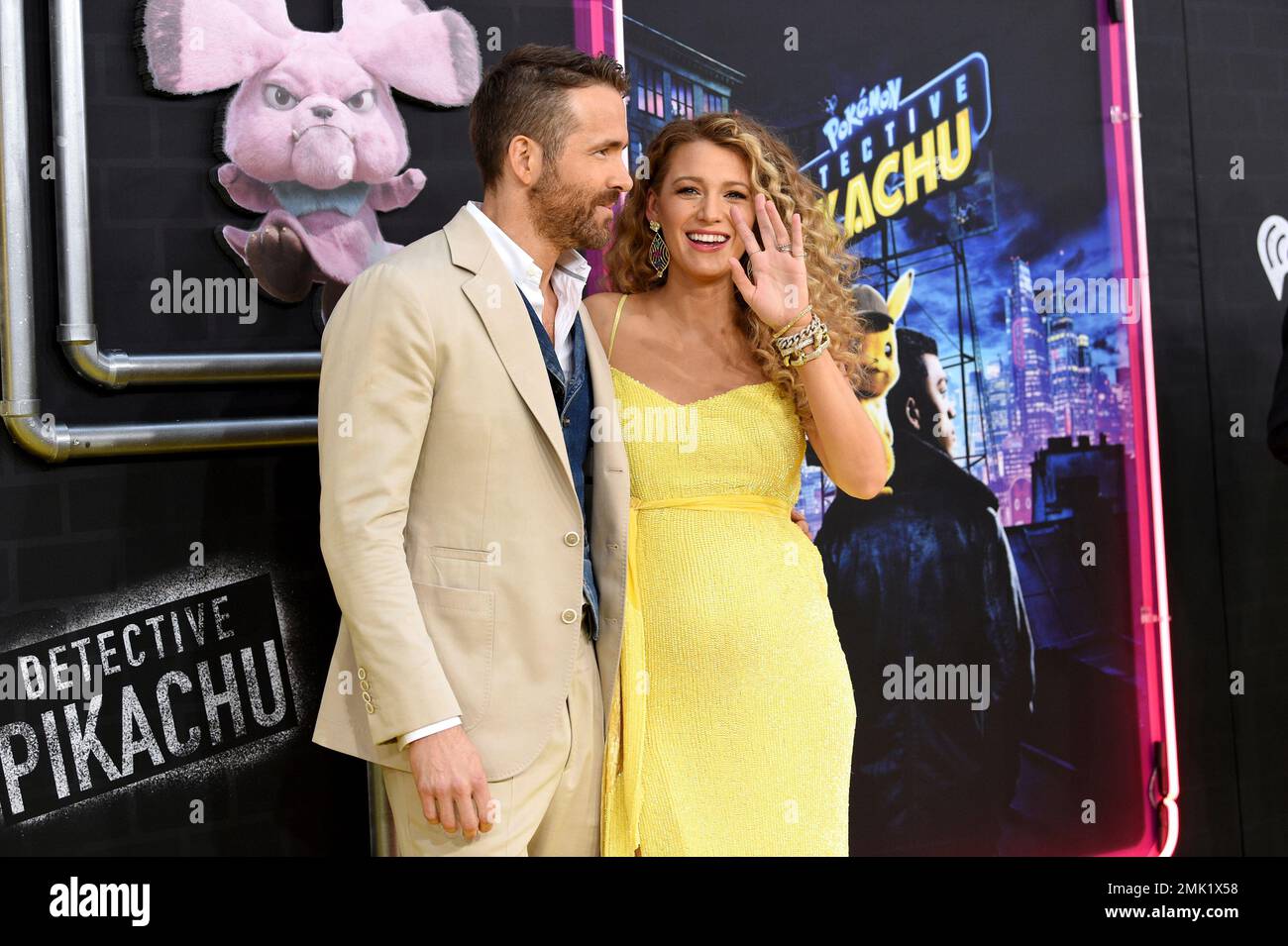 Actor Ryan Reynolds, left, is joined by his pregnant wife, actress Blake Lively at the premiere of "Pokemon Detective Pikachu" at Military Island in Times Square on Thursday, May 2, 2019, in New York. (Photo by Evan Agostini/Invision/AP) Banque D'Images
