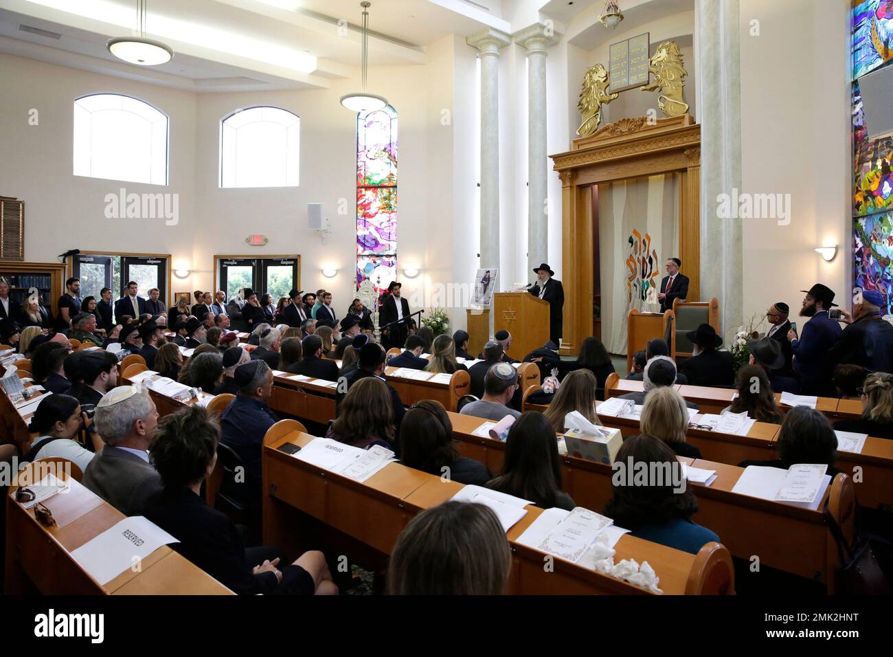 CORRECTS SPELLING OF RABBI'S FIRST NAME TO YISROEL INSTEAD OF YISHOEL - Yisroel Goldstein, at podium, Rabbi of Chabad of Poway, speaks Monday, April 29, 2019, during a memorial service for Lori Kaye, in Poway, Calif. Kaye was was killed Saturday when a gunman opened fire inside the Chabad of Poway synagogue, and Goldstein was injured in the shooting. (AP Photo/Gregory Bull) Banque D'Images
