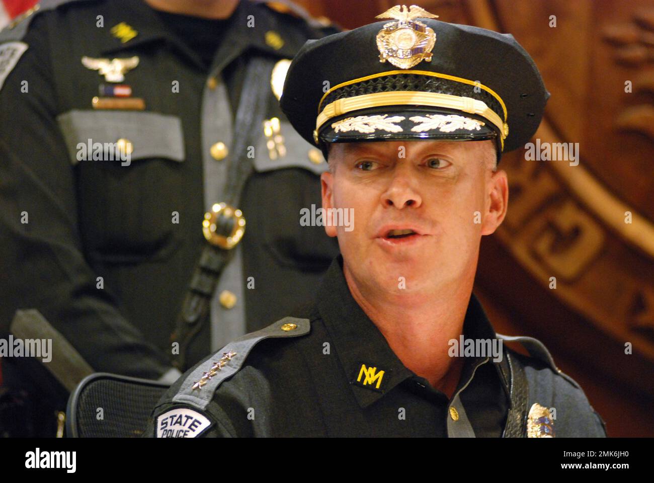 Newly appointed Mexico State Police Chief, Tim Johnson talks about his priorities for the law enforcement division at a news conference in Santa Fe, N.M., Friday, April 5, 2019. New Mexico Gov. Michelle Lujan Grisham appointed Johnson for his approach to recruitment and diversity. Women represent 7% of the State Police officers, a percentage far below the national average. Past allegations of discrimination, retaliation and lewd behavior against ex-Police Chief Pete Kassetas, not seen, have been settled by the state under undisclosed terms. (AP Photo/Morgan Lee) Banque D'Images