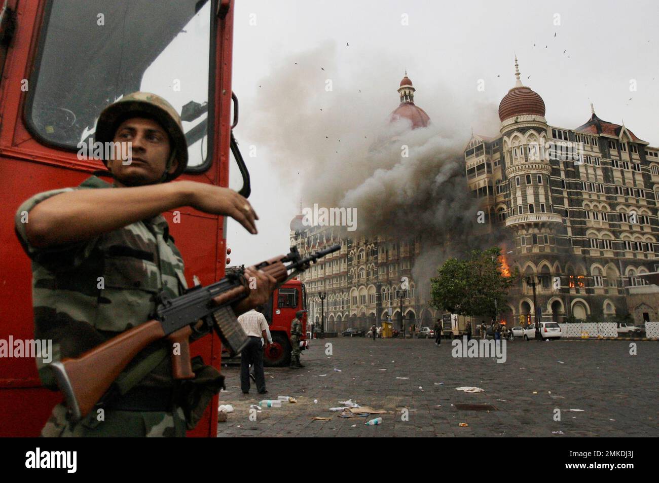 FILE In this Nov. 29, 2008, file photo, an Indian soldier takes cover