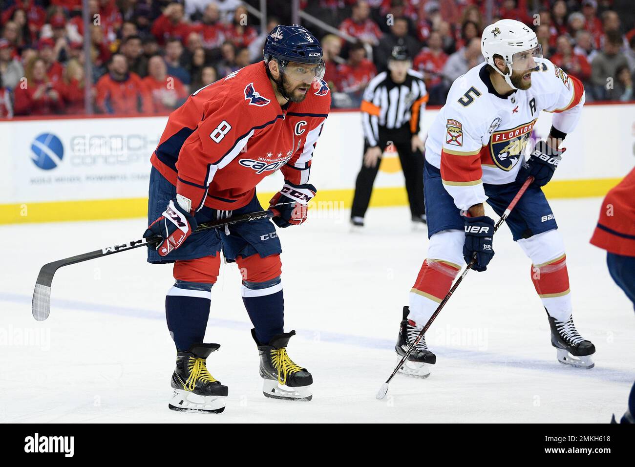 Washington Capitals left wing Alex Ovechkin (8), of Russia, stands on the ice next to Florida Panthers defenseman Aaron Ekblad (5) during the first period of an NHL hockey game, Saturday, Feb. 9, 2019, in Washington. (AP Photo/Nick Wass) Banque D'Images
