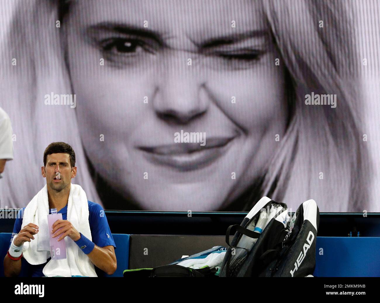Serbia's Novak Djokovic takes a drink during a break in his semifinal against France's Lucas Pouille at the Australian Open tennis championships in Melbourne, Australia, Friday, Jan. 25, 2019. (AP Photo/Mark Schiefelbein) Banque D'Images