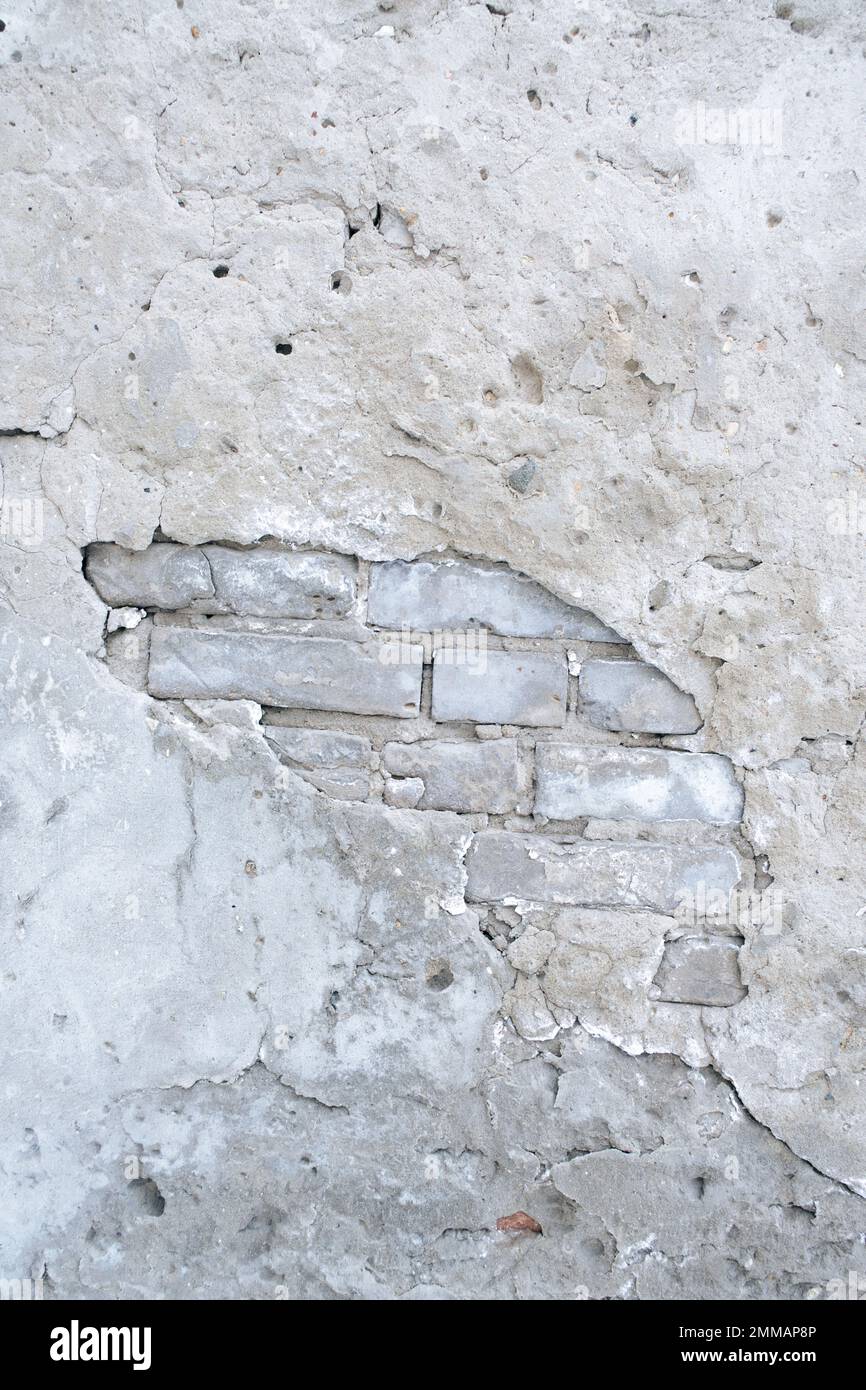 Vieux mur de brique avec plâtre de peeling Banque D'Images