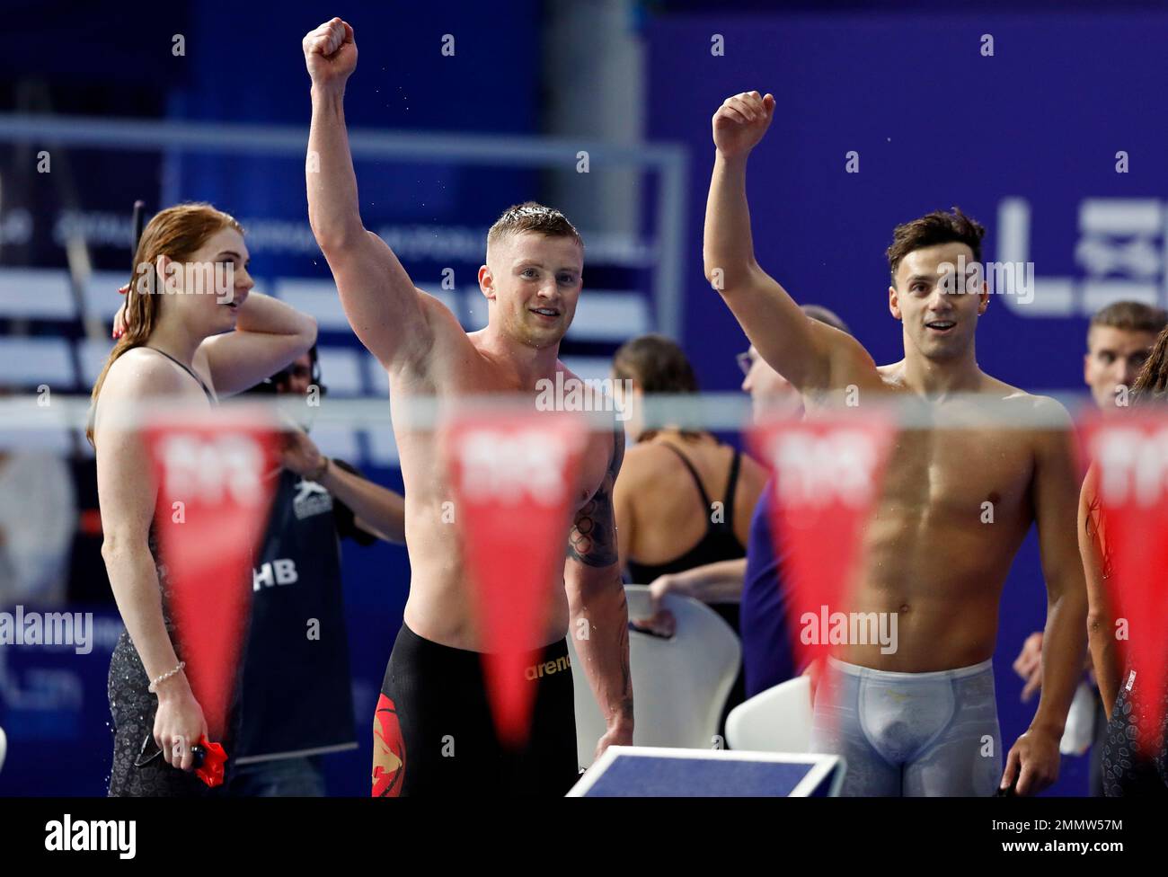 Freya Anderson, Adam Peaty and James Guy, from left to right, of Great Britain, react after winning the 4 X 100 meters medley relay mixed final at the European Swimming Championships in Glasgow, Scotland, Monday, Aug. 6, 2018. (AP Photo/Darko Bandic) Banque D'Images