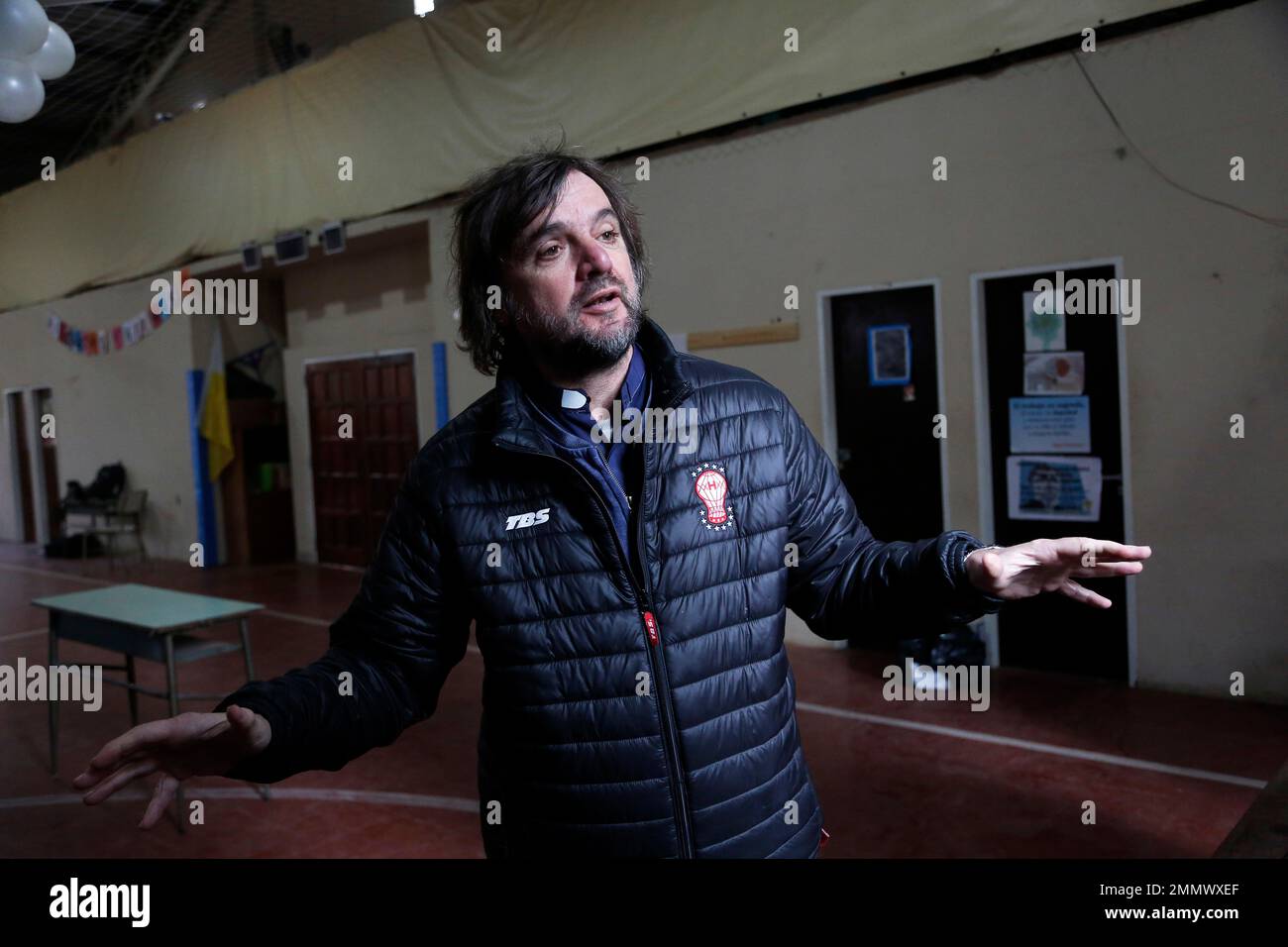 In this July 11, 2018 photo, priest Jose "Pepe" Di Paola, an opponent of the measure to expand legal abortions, speaks during an interview at the Virgen del Milagro church in Jose Leon Suarez, Argentina. (AP Photo/Jorge Saenz) Banque D'Images