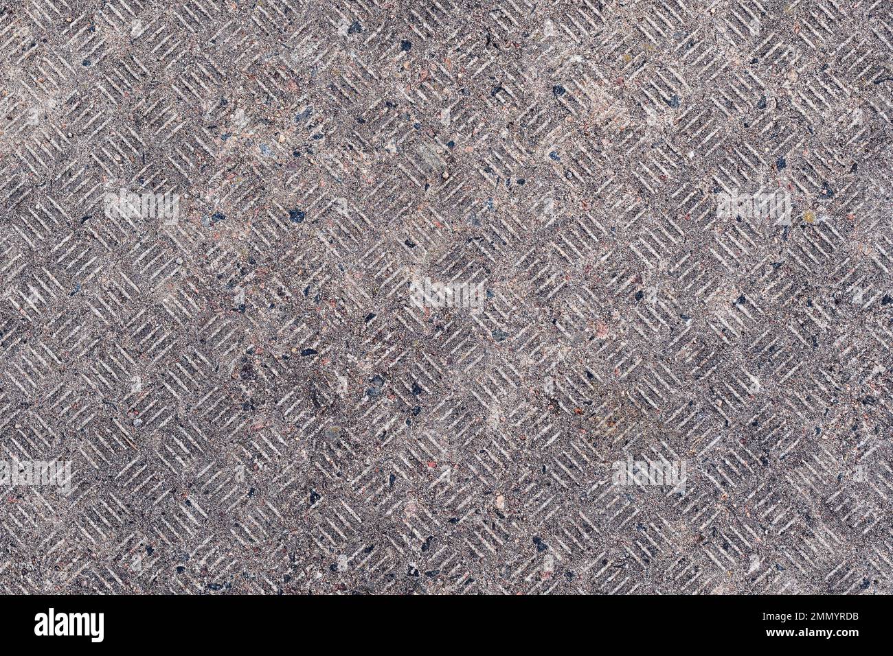 Surface en béton sale avec motif de plaque de roulement comme arrière-plan, vue de dessus Banque D'Images