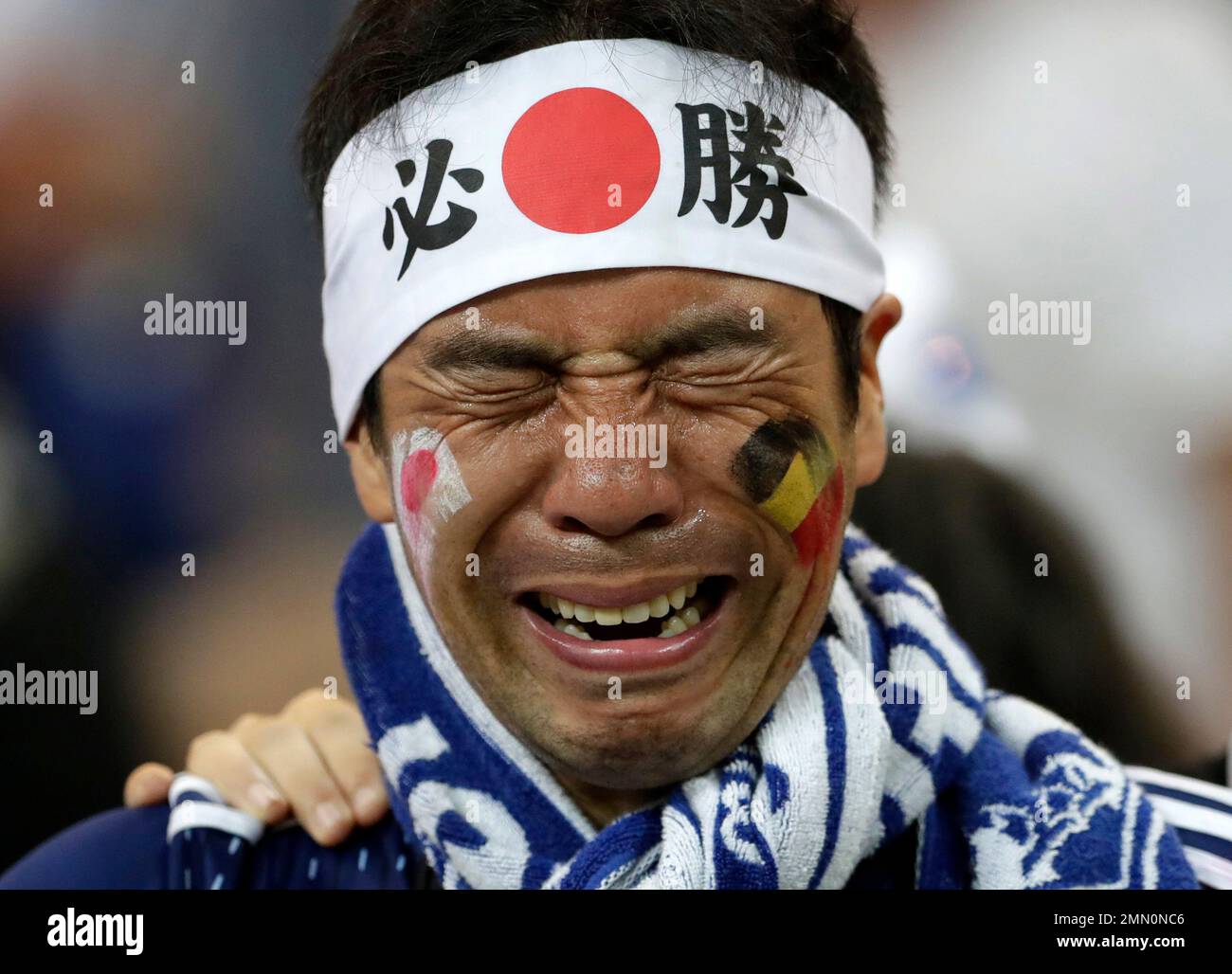 FILE - In this Monday, July 2, 2018 file photo a Japan supporters cries after losing the round of 16 match between Belgium and Japan at the 2018 soccer World Cup in the Rostov Arena, in Rostov-on-Don, Russia, Monday, July 2, 2018. (AP Photo/Petr David Josek, File) Banque D'Images