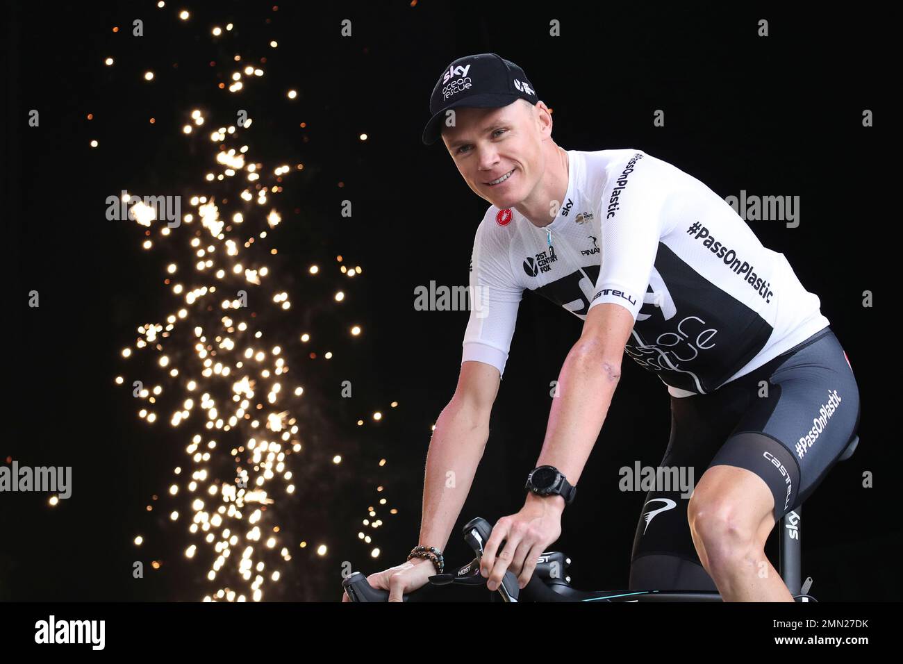 Fireworks go off as four-times Tour de France winner Britain's Chris Froome arrives on the podium during the Tour de France cycling race team presentation in La Roche-sur-Yon, Vendee region, France, Thursday, July 5, 2018, ahead of upcoming Saturday's start of the race. (AP Photo/Christophe Ena ) Banque D'Images