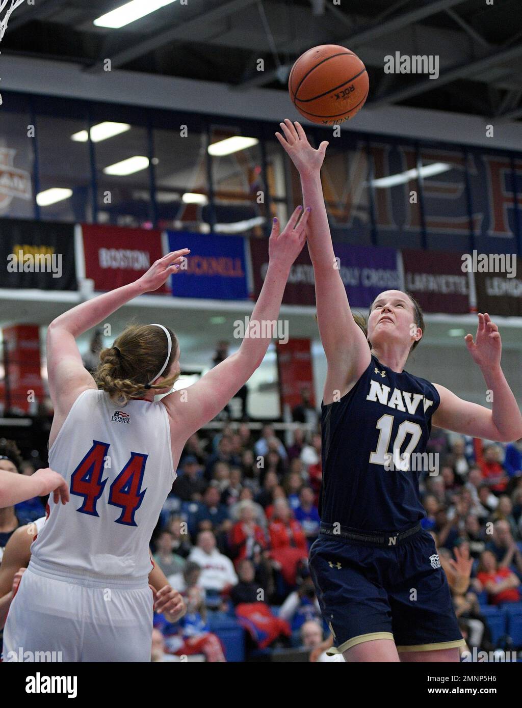 Navy forward Laurel Jaunich (10) battles for the ball against American