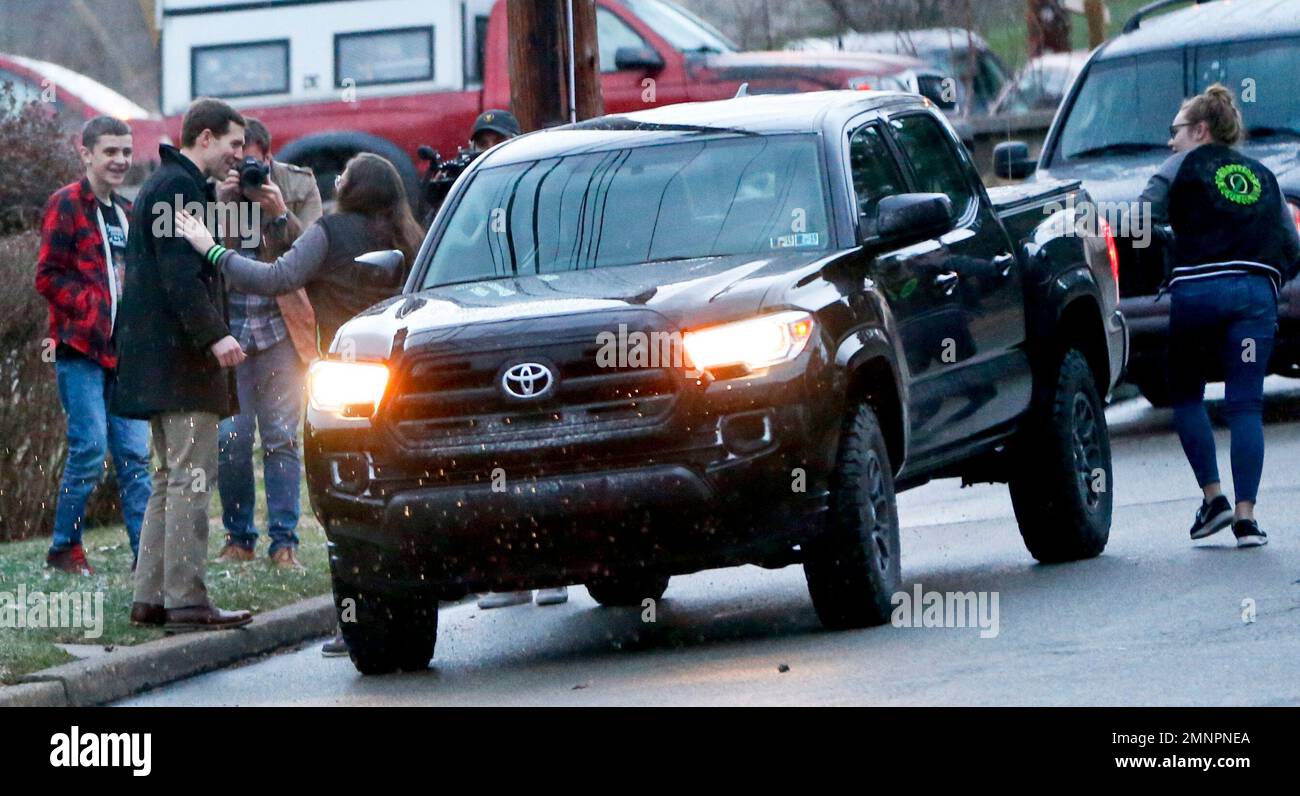 Democrat Conor Lamb, left, greets voters while on a campaign walk thrrough a neighborhood in Carnegie, Pa., Wednesday, March 7, 2018. Lamb is running against Republican Rick Saccone in a special election being held on March 13 for the PA 18th Congressional District vacated by Republican Tim Murphy. (AP Photo/Keith Srakocic) Banque D'Images