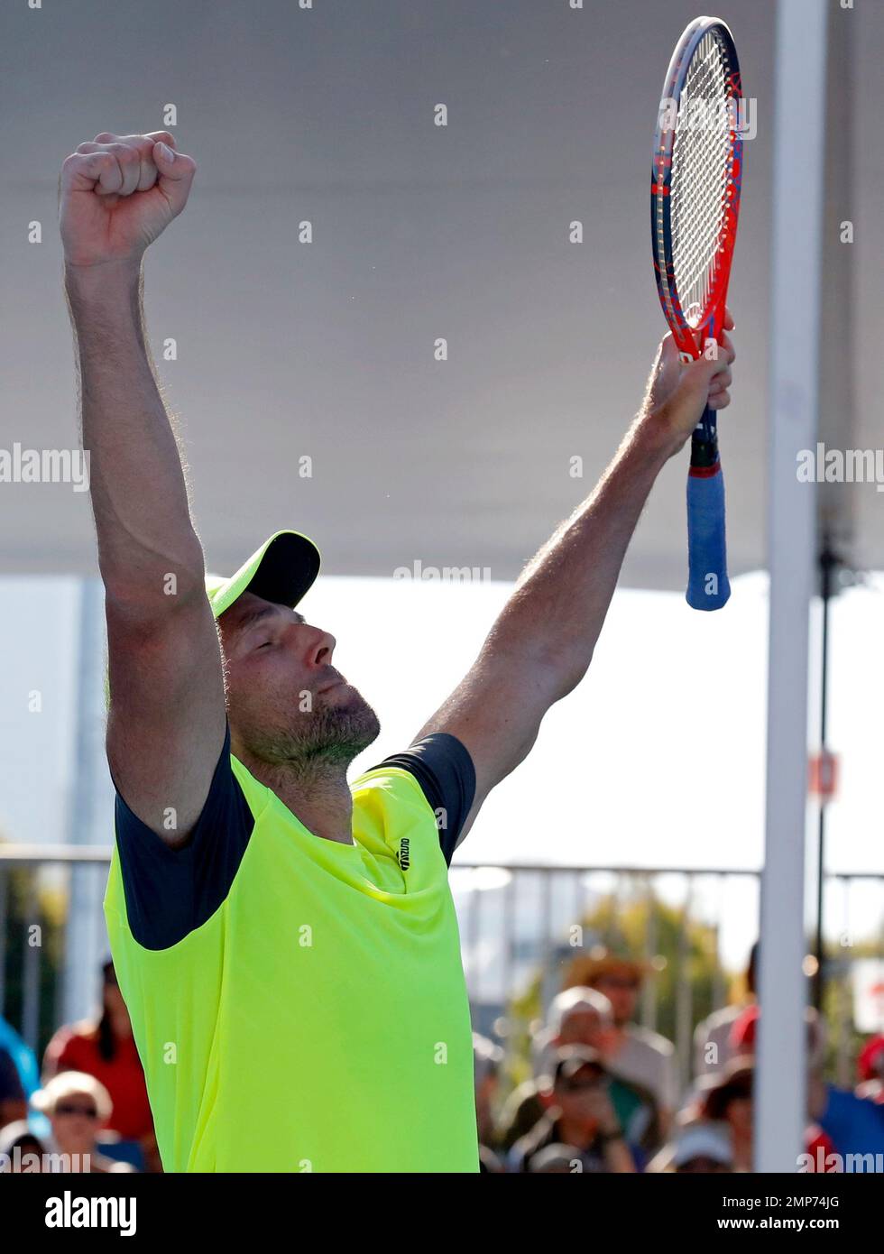 Croatia's Ivo Karlovic celebrates after defeating Japan's Yuichi Sugita during their second round match at the Australian Open tennis championships in Melbourne, Australia, Wednesday, Jan. 17, 2018. (AP Photo/Ng Han Guan) Banque D'Images