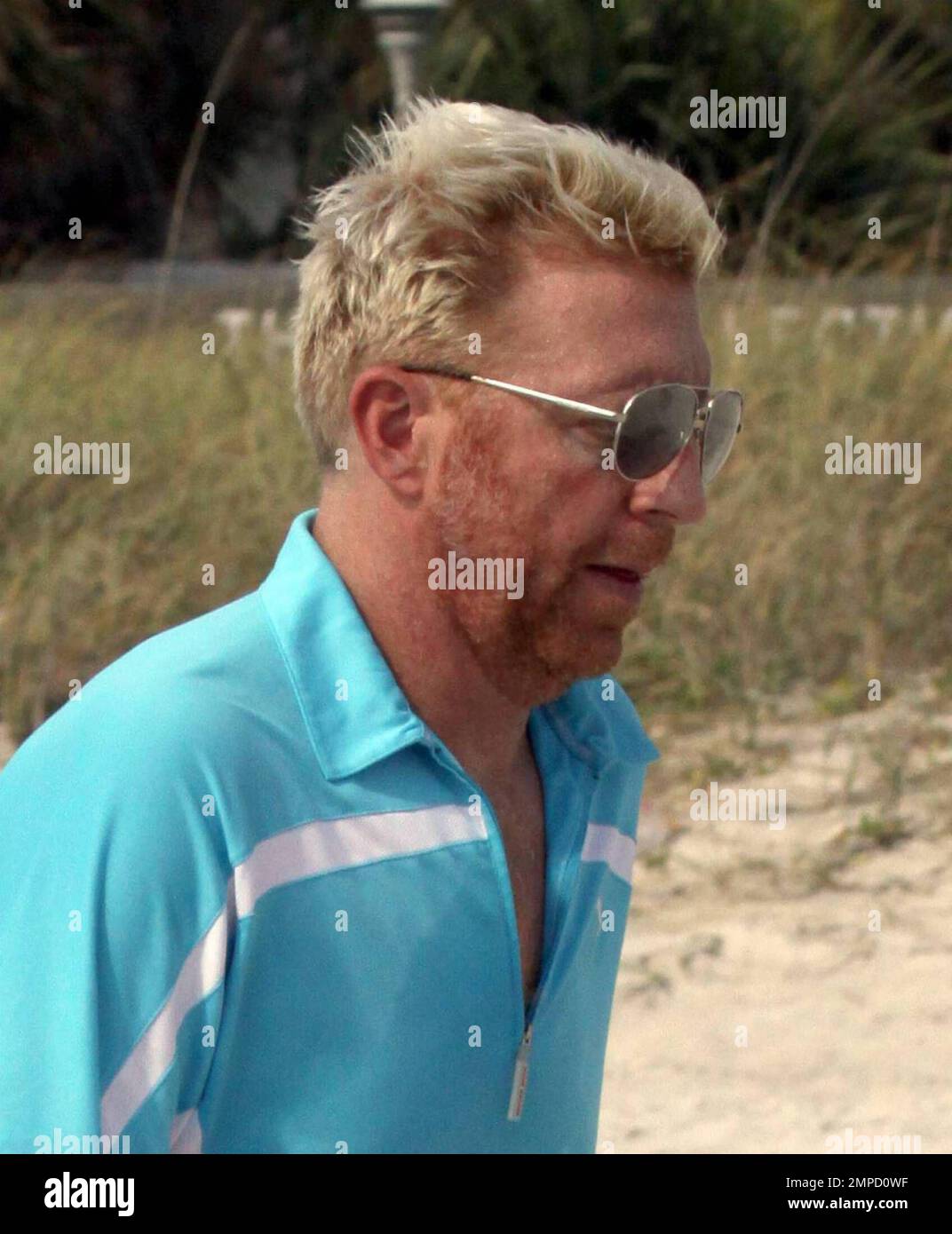 Exclusif !! Boris Becker et sa fiancée Sharlely Kersenberg vont faire un jogging sur la plage. Becker's bientôt pour être femme a quitté l'as de tennis dans la poussière à un point de la vapeur devant un Boris aspect sueur. Le couple est sur le point de se marier plus tard cette année. Miami, Floride. 3/31/09. Banque D'Images