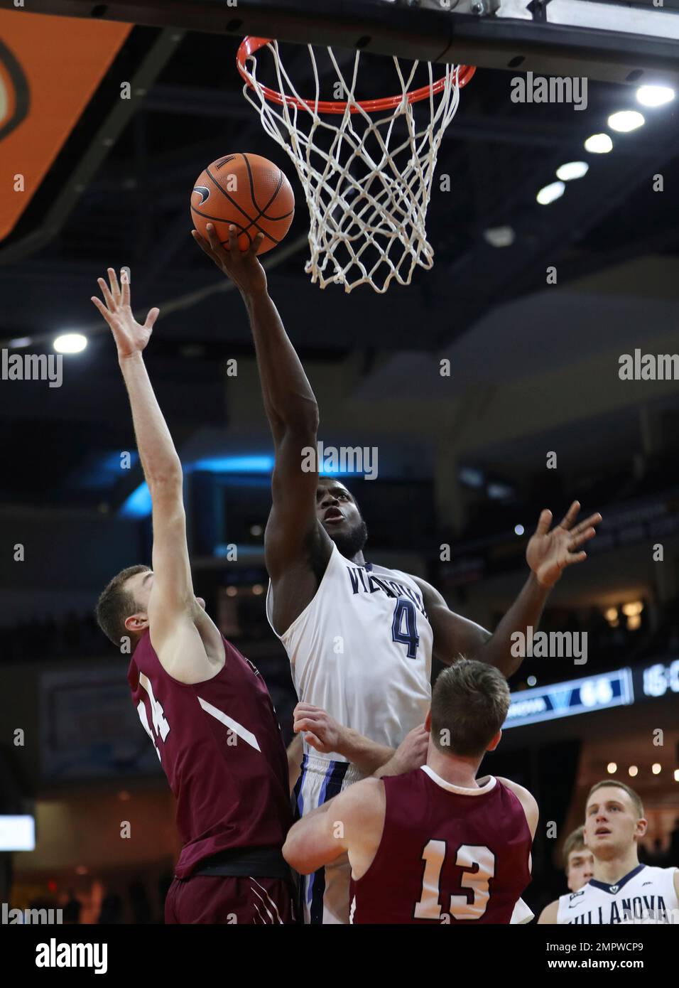 Villanova's Eric Paschall, center, goes up to shoot against Lafayette's