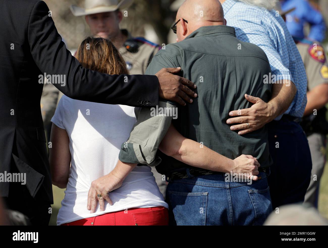 Pastor Frank Pomeroy and his wife Sherri are lead away from a news conference near the First Baptist Church of Sutherland Springs, Monday, Nov. 6, 2017, in Sutherland Springs, Texas. A man opened fire inside the church in the small South Texas community on Sunday, killing and wounding many. The Pomeroy's daughter, Annabelle, 14, was killed in the shooting. (AP Photo/Eric Gay) Banque D'Images