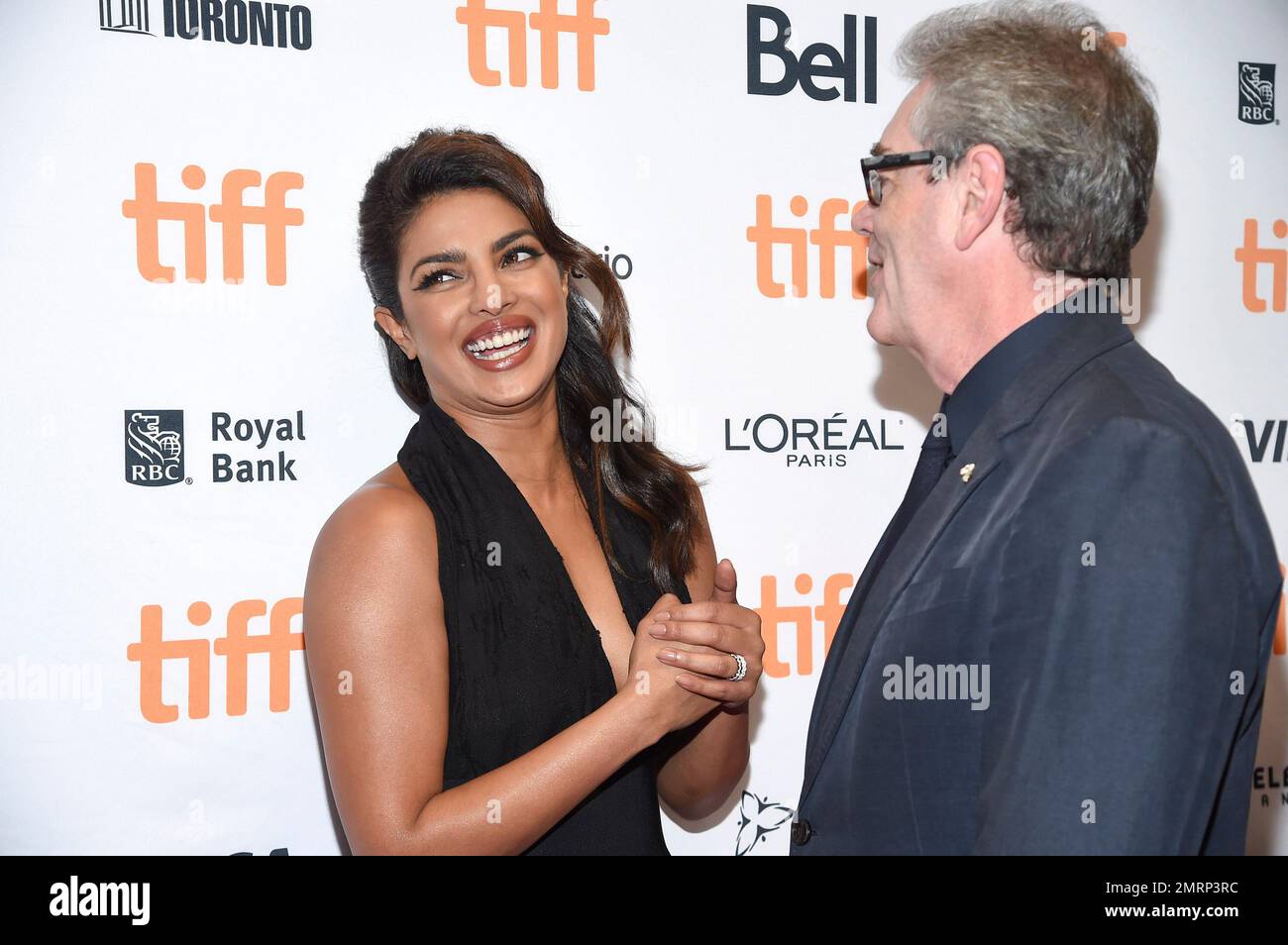 Actress Priyanka Chopra, left, chats with the director and CEO of TIFF Piers Handling at the TIFF Soiree, an annual fundraiser and celebratory kick-off for the 2017 Toronto International Film Festival, at the TIFF Bell Lightbox on Wednesday, Sept. 6, 2017, in Toronto. (Photo by Evan Agostini/Invision/AP) Banque D'Images