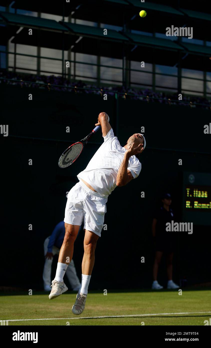 Germany's Tommy Haas serves to Belgium's Ruben Bemelmans during their Men's Singles Match on the opening day at the Wimbledon Tennis Championships in London Monday, July 3, 2017. (AP Photo/Alastair Grant) Banque D'Images