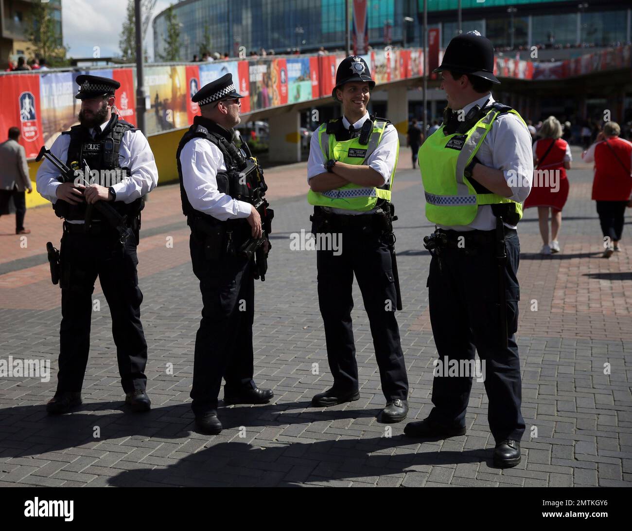 Armed police patrol outside Wembley Stadium ahead of the FA Cup final soccer match between Arsenal and Chelsea, in London, Saturday, May 27, 2017. (AP Photo/Tim Ireland) Banque D'Images